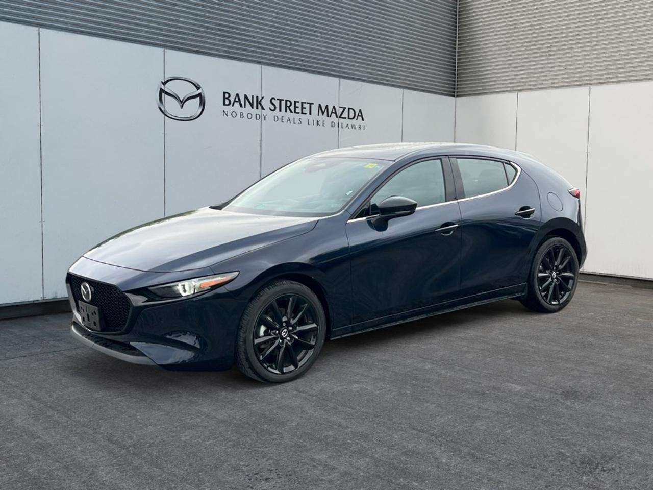 Experience the thrill behind the wheel of the 2024 Mazda3 Sport GT with Turbo, a meticulously designed sedan that boasts Mazdas iconic GT w/Turbo Auto i-ACTIV AWD system. This vehicle, draped in a dynamic color theme, offers a driving experience that is as controlled as it is exhilarating. On the outside, youll appreciate the sophistication of alloy wheels and the aerodynamic lines that give it a distinctive presence on the road. Step inside to find an interior that blends comfort and style, featuring leather seats and a leather steering wheel that exude luxury and confidence. The sunroof/moonroof adds a touch of elegance, enhancing your driving experience with natural light and panoramic views. The Mazda3 Sport GT w/Turbo is equipped with state-of-the-art technology and safety features designed to enhance every journey. Stay connected with Bluetooth integration and enjoy an intuitive navigation system displayed on a crisp heads-up display. Feel secure with advanced safety features including lane assist, backup camera, and brake assist. Plus, with adaptive cruise control and parking sensors, every drive is not only safer but more enjoyable. If youre a discerning driver looking for a blend of performance and style in your daily ride, the Mazda3 Sport GT with Turbo is tailored for you. Contact our dealership today to explore the features of this remarkable vehicle and take it for a test drive.
