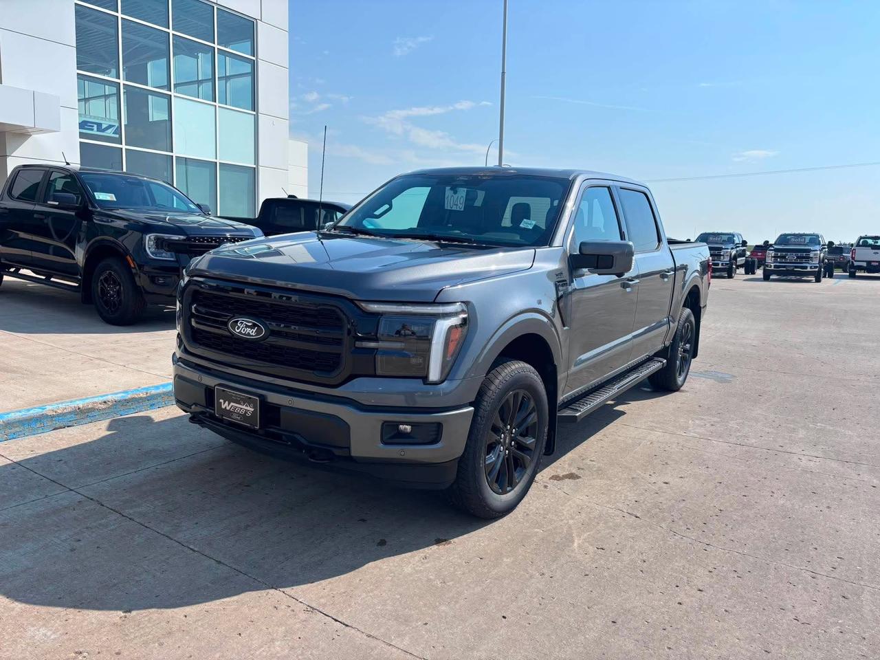 <p>Get ready to experience the pinnacle of capability and luxury with the brand new 2026 Ford F-150 4x4 SuperCrew-145, now available at Webbs 1441. This isnt just a truck; its a statement. Dressed in a striking Carbonized Grey Metallic, this F-150 is built to conquer any challenge while surrounding you in premium comfort. Under the hood, the powerful 3.5L V6 EcoBoost engine paired with an electronic 10-speed automatic transmission delivers exhilarating performance and impressive towing prowess, making it the perfect partner for both work and adventure.</p><p>&nbsp;</p><p>Step inside the meticulously crafted interior, featuring the Lariat Black Appearance Package and comfortable Black ActiveX trim seats, and youll find a cabin designed for the modern driver. From the convenience of the driver-side keypad entry to the expansive Twin Panel Moonroof that floods the cabin with natural light, every detail has been considered. Plus, with the included 90-day trial of BlueCruise, you can experience the future of hands-free driving on compatible highways. This 2026 F-150 is more than just a vehicle; its your command centre for lifes journeys.</p><p>&nbsp;</p><p>Here are five features that truly set this 2026 Ford F-150 apart:</p><p><br><br></p><ul><li><strong>3.5L V6 EcoBoost Engine:</strong> Unleash a surge of power and efficiency with this renowned engine, engineered for exceptional performance and capability.</li></ul><p>&nbsp;</p><ul><li><strong>Twin Panel Moonroof:</strong> Elevate your driving experience with an expansive moonroof that brings the outdoors in, creating an open and airy atmosphere.</li></ul><p>&nbsp;</p><ul><li><strong>BlueCruise Equipped (90-Day Trial):</strong> Embrace the future of driving with hands-free highway driving capabilities on compatible roads.</li></ul><p>&nbsp;</p><ul><li><strong>Lariat Black Appearance Package:</strong> Make a bold statement with a sophisticated and aggressive aesthetic, featuring sleek black accents and wheels.</li></ul><p>&nbsp;</p><ul><li><strong>20 Gloss Black Painted Aluminum Wheels:</strong> These striking wheels not only enhance the trucks rugged stance but also add a touch of premium style.</li></ul><p><br><br></p><p><strong><em>Powered by AutoIntelligence&trade;</em></strong></p><p>&nbsp;</p><p>Powered by AutoIntelligence&trade;</p><p>&nbsp;</p>