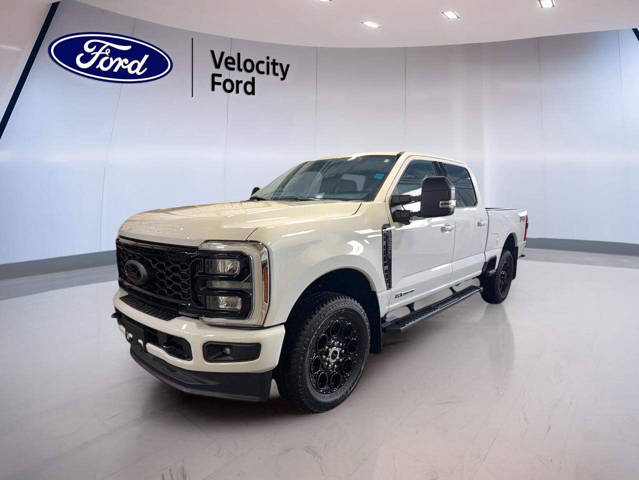 Built for hard work and ready for long days, the 2026 Ford Super Duty F-350 SRW XLT 4WD Crew Cab 6.75 Box is brand new and waiting at Velocity Ford in Moose Jaw. Its White exterior, Black interior, four full doors, automatic transmission, and 6.7-litre diesel engine create a confident truck for towing, hauling, and daily use.

This heavy-duty pickup brings the strength drivers expect from Ford, along with practical comfort and useful technology. The 2026 Ford Super Duty F-350 SRW XLT 4WD Crew Cab 6.75 Box is well suited for job sites, highway travel, and weekend towing, with a rated towing capacity of 6,349 kg.

FEATURES OF THE Super Duty F-350 SRW XLT 4WD Crew Cab 6.75 Box
»» Crew Cab with four full doors
»» 6.75-foot box for versatile hauling
»» 6.7-litre diesel power for demanding work
»» Four-wheel drive for added traction

TRUCK FEATURES
»» Towing capacity rated at 6,349 kg
»» Rear tow hook supports work readiness
»» Limited slip differential aids traction
»» Single rear wheel setup for balance

ADVANCED SAFETY FEATURES
»» Anti-lock braking system helps controlled stops
»» Stability control supports secure handling
»» Backup camera improves reversing visibility
»» Multiple airbags add occupant protection

PERFORMANCE AND EFFICIENCY
»» 6.7-litre diesel engine delivers strong torque
»» Automatic transmission supports smooth operation
»» Dual shift mode adds control
»» Four-wheel drive boosts grip in conditions

COMFORT AND CONVENIENCE
»» Front air conditioning keeps cabin comfortable
»» Power windows add everyday ease
»» Driver lumbar support helps reduce fatigue
»» Cruise control supports relaxed highway travel

TECHNOLOGY AND CONNECTIVITY
»» Bluetooth integration supports hands-free communication
»» Wi-Fi hotspot keeps devices connected
»» Satellite radio expands entertainment choices
»» Steering wheel audio controls add convenience

CARGO SPACE
»» 6.75-foot box handles useful cargo
»» Rear trunk access simplifies loading
»» Spare tire supports worksite confidence
»» Crew cab adds secure interior storage

WHAT OTHER OWNERS LIKE
»» Strong diesel pulling power for towing
»» Spacious crew cab for family use
»» Four-wheel drive for year-round confidence
»» Useful technology for daily driving ease

The XLT trim is known for offering practical value in a heavy-duty truck, and this Super Duty keeps the focus on the features that matter most. Heated mirrors, electric mirrors, turn signal mirrors, fog lights, automatic headlights, tinted windows, and automatic door locks all help make every day easier.

Inside, the cabin is designed for simple control and steady comfort. The power drivers seat, adjustable steering wheel, illuminated drivers side vanity mirror, illuminated passenger vanity mirror, and passenger airbag sensor add thoughtful convenience. Child safety locks and tire pressure monitoring also support family and work use alike.

This new truck is ready to serve drivers who need real capability without giving up comfort or connectivity. Whether you are towing equipment, carrying supplies, or heading out across Saskatchewan roads, this Ford delivers the toughness and everyday usability expected from a Super Duty.

This 2026 Ford Super Duty F-350 SRW XLT 4WD Crew Cab 6.75 Boxs VIN is: 1FT8W3BT9TEE55608.