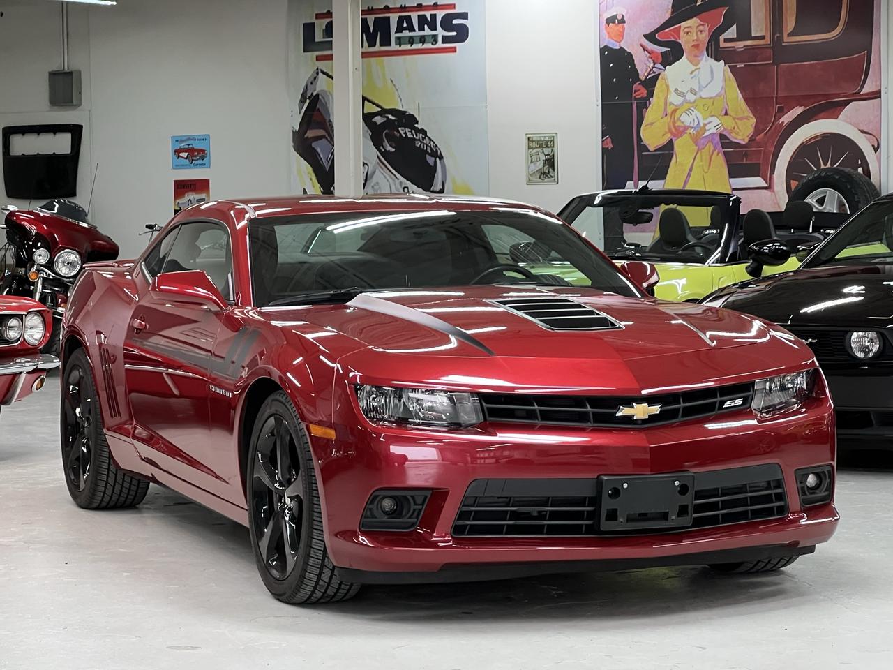 <p class=isSelectedEnd>2014 Chevrolet Camaro SS Coupe<br>43,000 kms | Crystal Claret Tintcoat | Exceptional Condition</p><p class=isSelectedEnd>Purchased from us in 2016 and just traded in with just 43,000 kms, this Camaro presents beautifully and has clearly been well loved.</p><p class=isSelectedEnd>The body, paint, interior, and overall presentation are all in outstanding condition. A modern muscle car with the right look, the right sound, and legendary styling.</p><p class=isSelectedEnd>Powered by the 6.2L LS3/L99 V8 paired to the 6-speed automatic transmission with paddle shift capability and limited-slip differential.</p><p class=isSelectedEnd>Factory equipped with:<br>&bull; RS Appearance Package<br>&bull; 20&rdquo; Aluminum Wheels<br>&bull; Rear Spoiler<br>&bull; Fog Lamps<br>&bull; Boston Acoustics Premium Audio<br>&bull; 7&rdquo; Touchscreen Infotainment<br>&bull; Bluetooth / USB / Streaming Audio<br>&bull; Remote Start<br>&bull; Heated Power Seats<br>&bull; Leather-Wrapped Steering Wheel & Shift Knob<br>&bull; Heads-Up Driver Information Display<br>&bull; Dual-Zone Climate Control<br>&bull; Limited Slip Differential<br>&bull; Sport Suspension</p><p class=isSelectedEnd>The Crystal Claret Tintcoat finish gives this Camaro a deep, rich appearance that stands out from the typical red or black examples. Combined with the aggressive body lines and V8 performance, it&rsquo;s a car that still turns heads everywhere it goes.</p><p class=isSelectedEnd>Fully inspected, professionally detailed, and ready to enjoy.</p><p>Easy to buy. A pleasure to own. Guaranteed.</p>