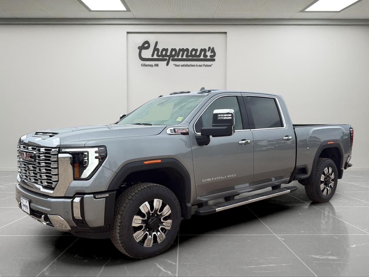 <p>Finished in Sterling Metallic with a Jet Black interior, this 2026 GMC Sierra 2500HD Denali Crew Cab delivers premium luxury, heavy-duty capability, and advanced trailering technology in one refined package. Designed for serious towing and hauling while maintaining upscale comfort, the Denali trim combines bold styling with professional-grade performance.</p><p>Powered by the legendary Duramax 6.6L V8 Turbo Diesel paired with a 10-speed automatic transmission, this Sierra 2500HD delivers exceptional torque and towing capability. Equipped with a 2-speed electronic Autotrac transfer case, integrated trailering technologies, and available gooseneck/5th wheel prep, its built to handle demanding jobs and long hauls with confidence.</p><h3>Performance & Capability</h3><ul><li><p>Duramax 6.6L V8 Turbo Diesel engine</p></li><li><p>10-speed automatic transmission</p></li><li><p>4WD with 2-speed electronic Autotrac transfer case</p></li><li><p>Gooseneck/5th wheel prep package</p></li><li><p>Integrated trailer brake controller</p></li><li><p>Trailering package with hitch guidance and hitch view</p></li><li><p>In-vehicle trailering app</p></li><li><p>Auto-locking rear differential</p></li><li><p>Digital variable steering assist</p></li><li><p>Stabilitrak with trailer sway control and hill start assist</p></li><li><p>High idle switch</p></li><li><p>Trailer tire pressure monitor sensors</p></li><li><p>3.42 rear axle ratio</p></li></ul><h3>Interior Comfort & Convenience</h3><ul><li><p>Heated and ventilated front seats</p></li><li><p>Heated rear outboard seats</p></li><li><p>12-way power driver seat</p></li><li><p>Driver seat and mirror memory</p></li><li><p>Heated leather-wrapped steering wheel</p></li><li><p>Dual-zone automatic climate control</p></li><li><p>Wireless charging</p></li><li><p>Power sliding rear window</p></li><li><p>Universal home remote</p></li><li><p>Rear camera mirror</p></li><li><p>120V AC power outlets in cabin and cargo bed</p></li><li><p>Adaptive cruise control</p></li></ul><h3>Technology & Connectivity</h3><ul><li><p>GMC Premium Infotainment System with 13.4" touchscreen</p></li><li><p>Google built-in compatibility with navigation capability</p></li><li><p>Wireless Apple CarPlay & Android Auto</p></li><li><p>Bose premium audio system</p></li><li><p>12.3" digital driver information centre</p></li><li><p>Multicolour 15" head-up display</p></li><li><p>SiriusXM capability</p></li><li><p>OnStar Basics connected services</p></li><li><p>Bluetooth connectivity</p></li><li><p>Bed view camera</p></li></ul><h3>Safety & Driver Assistance</h3><ul><li><p>HD surround vision</p></li><li><p>Trailer side blind zone alert</p></li><li><p>Rear cross traffic alert</p></li><li><p>Forward collision alert</p></li><li><p>Automatic emergency braking</p></li><li><p>Front pedestrian braking</p></li><li><p>Lane departure warning</p></li><li><p>Following distance indicator</p></li><li><p>Front and rear park assist</p></li><li><p>Safety alert seat</p></li><li><p>IntelliBeam automatic high beams</p></li></ul><h3>Exterior Highlights</h3><ul><li><p>Sterling Metallic exterior</p></li><li><p>20" ultra-bright machined aluminum wheels</p></li><li><p>Chrome assist steps</p></li><li><p>GMC MultiPro tailgate</p></li><li><p>Spray-on bedliner</p></li><li><p>Animated LED projector headlamps</p></li><li><p>LED fog lamps</p></li><li><p>LED cargo bed lighting</p></li><li><p>Power folding and extending heated mirrors</p></li><li><p>Rain-sensing wipers</p></li><li><p>Molded splash guards</p></li></ul><p>A premium heavy-duty truck that combines Duramax diesel power, advanced towing technology, and Denali luxury for serious capability without compromising comfort.</p><p>2 Year/24,000 kilometer* Complimentary Oil Changes (2 total)</p><p>3 Year/60,000 kilometer* Base Warranty Coverage</p><p>5 Year/100,000 kilometer* Powertrain Component Warranty Coverage</p><p>5 Year/100,000 kilometer* Courtesy Transportation and 24/7 Roadside Assistance</p><p>6 Year/160,000 kilometer* Sheet Metal (Rust Through) Perforation Warranty Coverage</p><p>*Whichever Comes First.</p><p>Price Includes HD Flaps & 6 Tube Steps.</p><p>Price Includes Dealer Fee.</p><p>Price Excludes PST & GST.</p><p>Financing Options Available, Call For More Details.</p> <p><strong>*While every reasonable effort is made to ensure the accuracy of this information, we are not responsible for any error or omissions contained on these pages. Please verify any information in question with Chapman Motors Ltd.</strong></p>