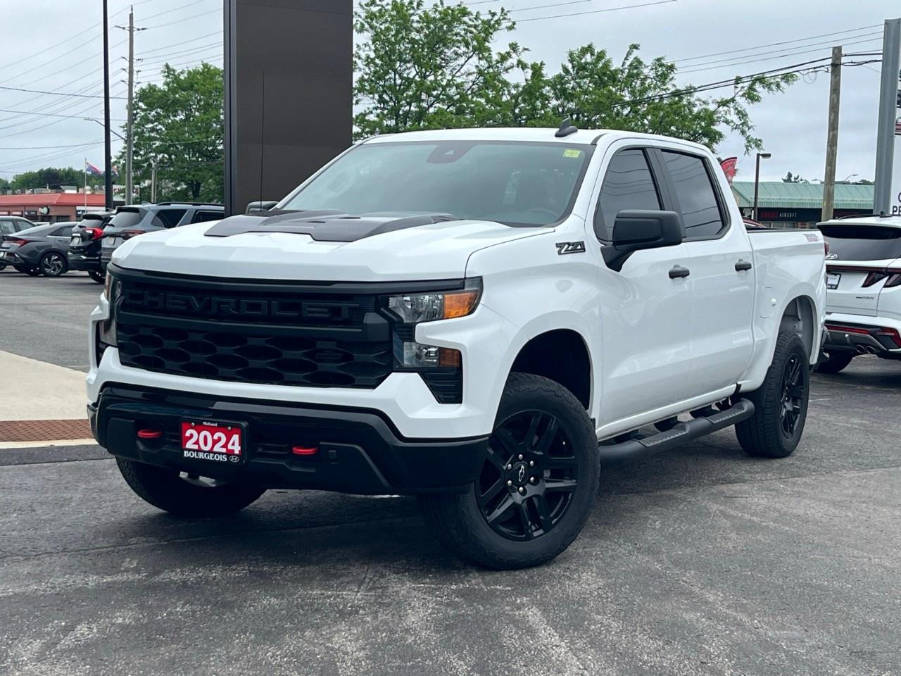 <p>Introducing the stunning 2024 Chevrolet Silverado 1500 Custom Trail Boss, a rugged and stylish white 4×4 truck designed to tackle any terrain with confidence. As part of the remarkable Crew Cab Short Box 4-Wheel Drive setup, this powerhouse ensures superior handling in any condition.</p><p>The bold exterior is perfectly complemented by sleek black alloy wheels and heated mirrors, accentuating its commanding presence on the road. Inside, the black interior provides a modern and functional cabin space equipped with advanced conveniences.</p><p>Loaded with innovative technology, the Silverado comes with a backup camera, a user-friendly Bluetooth connection, and smart device integration for seamless connectivity. The large touch screen display offers comfort and peace of mind, integrating satellite radio and a Wi-Fi hotspot for endless entertainment possibilities. Safety features like lane assist and cruise control ensure a secure driving experience for all.</p><p>This truck is ideal for those seeking adventure without compromising on style and technology. Whether you're an outdoor enthusiast or simply need a reliable workhorse, contact our dealership today to experience the power and versatility of the 2024 Chevrolet Silverado 1500 Custom Trail Boss.</p> <p><strong>Why Choose the Bourgeois Auto Group?</strong></p><p>For 80 years, Bourgeois Auto Group has been delivering exceptional automotive experiences. Our factor trained teams work to ensure you receive the shopping experience you deserve; whether you're looking for a new or new-to-you vehicle.</p><p>Shop 24/7 with our online showroom and chat service, ensuring convenience every step of the way. No hidden fees, full disclosure, and every pre-owned vehicle comes with a Carfax® report for peace of mind.</p><p>We offer a wide selection of pre-owned vehicles, all competitively priced using real-time market data. Get the best deal on your purchase and trade-in with our free Live Market Analysis report.</p><p>Looking to sell your car? We buy any make or modelno purchase required. Our simple to use online trade valuation tool will provide you with a clear, transparent selling experience whether you buy our car or not.</p><p>Backed by hundreds dedicated employees across 4 convenient locations, were here to meet all your automotive needs. Visit us in Midland or Parry Sound and explore our inventory or schedule your next service today.</p> <p><strong>Financing Your Next Vehicle with Bourgeois Midland Hyundai:</strong></p><p>At Bourgeois Midland Hyundai, we make financing your next vehicle simple and stress-free! Our team works with trusted lenders to find flexible options tailored to your budget. Drive away with confidenceapply today!</p><p>Take advantage of our online pre-qualification tool, backed by Equifax and TD Bank to find the payment that works for you. Simply <a href=https://www.bourgeoishyundai.com/pre-qualify-for-financing/ rel=nofollow><strong>CLICK HERE</strong></a> to use our secure online credit tool with no impact to your credit. </p>