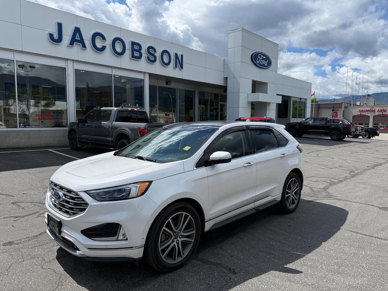 <p>Heres a stylish and well-equipped crossover that wont break the bank: this 2019 Ford Edge Titanium. Finished in an eye-catching White Platinum Tri-Coat, this Titanium trim brings a premium look and feel to a comfortable, practical SUV. With 87,297 km, it has been well cared for and offers great value for the price. Enjoy heated leather seats, a panoramic vista roof, and a responsive navigation system that make every drive easier. This Edge is comfortable, feature-packed, and ready for its next adventure. Visit Jacobson Ford today and take this Titanium Edge for a test drive!</p>