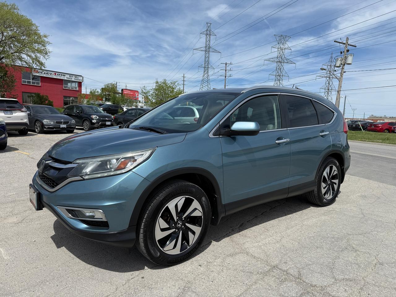 <p>Looking for a versatile and reliable SUV thats perfect for Canadian adventures? Select Auto Centre Ltd. is thrilled to present this fantastic 2015 Honda CR-V Touring, a vehicle that has been meticulously cared for and comes with the peace of mind of a <em>ONE OWNER</em> history and a <em>CLEAN CARFAX</em> report. With its striking BLUE exterior and comfortable grey interior, this CR-V offers a blend of style and practicality thats hard to beat. Whether youre navigating city streets or exploring the great outdoors, its all-wheel-drive capability ensures confident handling in any condition.</p><p>This 2015 Honda CR-V Touring, with a well-earned 259,316 kilometers on the odometer, represents an exceptional opportunity to own a highly sought-after vehicle known for its dependability and spacious interior. The gasoline-powered engine paired with a smooth Variable/CVT transmission makes for an efficient and enjoyable driving experience. This 4-door SUV/Crossover body style is ideal for families, adventurers, and anyone who appreciates a vehicle that can handle it all. Come on down to Select Auto Centre Ltd. and see how this CR-V can fit seamlessly into your life.</p><p>Here are 5 sizzling features of this 2015 Honda CR-V Touring:</p><ul><li><strong>Touring Trim:</strong> Experience the pinnacle of CR-V luxury and technology, designed to elevate every drive.</li><li><strong>All-Wheel Drive:</strong> Conquer Canadian winters and any terrain with confidence thanks to its intelligent and responsive AWD system.</li><li><strong>One Owner & Clean Carfax:</strong> Enjoy the reassurance of a single, well-maintained owner and a history free of accidents.</li><li><strong>Versatile SUV/Crossover Body Style:</strong> Ample cargo space and a comfortable cabin make it perfect for everything from daily commutes to weekend getaways.</li><li><strong>Reliability Redefined:</strong> Hondas renowned reputation for engineering excellence means this CR-V is built to last, offering dependable performance mile after mile.</li><li>$11888 + HST & LIC. CERTIFIED. NO HIDDEN FEES.</li></ul><p><strong><em>Powered by AutoIntelligence&trade;</em></strong></p><p>Vehicle information has been generated using artificial intelligence and is provided for informational purposes only. While efforts are made to ensure accuracy, please confirm all details directly with the dealer.</p>