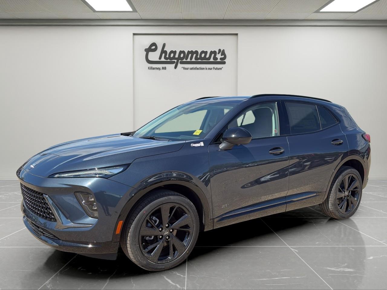 <p>Finished in stunning Quartz Blue Metallic with a distinctive Garnet and Ebony interior, this 2026 Buick Envision Sport Touring AWD blends premium luxury, advanced technology, and confident all-wheel drive capability into one refined SUV. The Sport Touring trim adds athletic styling cues and upscale finishes, creating a vehicle that's as eye-catching as it is comfortable.</p><p>Powered by a responsive 2.0L turbocharged 4-cylinder engine paired with a smooth 9-speed automatic transmission, the Envision delivers confident performance and excellent highway manners. With a premium interior, cutting-edge technology, and a comprehensive suite of safety features, it's designed to elevate every drive.</p><h3>Performance & Capability</h3><p> 2.0L turbocharged 4-cylinder engine  9-speed automatic transmission  All-wheel drive (AWD)  Engine stop-start technology  20" aluminum wheels with Carbon Flash Metallic finish  17" spare wheel and tire</p><h3>Interior Comfort & Convenience</h3><p> Perforated leather-appointed seating  Heated front seats  Heated steering wheel  8-way power driver seat  4-way power lumbar support  Driver memory settings  Buick QuietTuning with Active Noise Cancellation  Ambient interior lighting  Leather-wrapped flat-bottom steering wheel  Rear cargo cover  Sport alloy pedals  Remote vehicle start</p><h3>Technology & Connectivity</h3><p> Ultra-wide 30" diagonal display screen  Google Built-In with navigation  Wireless Apple CarPlay  Wireless Android Auto  Wireless phone charging  Bose 9-speaker premium audio system  Bluetooth audio streaming  Personalized driver profiles  Universal Home Remote  SiriusXM capability  OnStar connected services</p><h3>Safety & Driver Assistance</h3><p> Adaptive Cruise Control  HD Surround Vision  Head-Up Display  Enhanced Automatic Emergency Braking  Intersection Automatic Emergency Braking  Forward Collision Alert  Lane Keep Assist with Lane Departure Warning  Blind Zone Steering Assist  Rear Cross Traffic Braking  Rear Pedestrian Alert  Front Pedestrian and Bicyclist Braking  Side Bicyclist Alert  Reverse Automatic Braking  Traffic Sign Recognition  Rear Park Assist  Following Distance Indicator  IntelliBeam automatic high beams  Safety Alert Seat  Teen Driver technology</p><h3>Exterior Highlights</h3><p> Quartz Blue Metallic exterior  Sport Touring appearance package  Enhanced LED headlamps  Heated power mirrors with memory settings  Driver-side auto-dimming mirror  Carbon Flash Metallic wheel finish  Athletic Sport Touring styling cues</p><p>A premium compact SUV that combines turbocharged performance, cutting-edge technology, luxury appointments, and advanced safety features in a stylish all-wheel drive package.</p> <p><strong>*While every reasonable effort is made to ensure the accuracy of this information, we are not responsible for any error or omissions contained on these pages. Please verify any information in question with Chapman Motors Ltd.</strong></p>