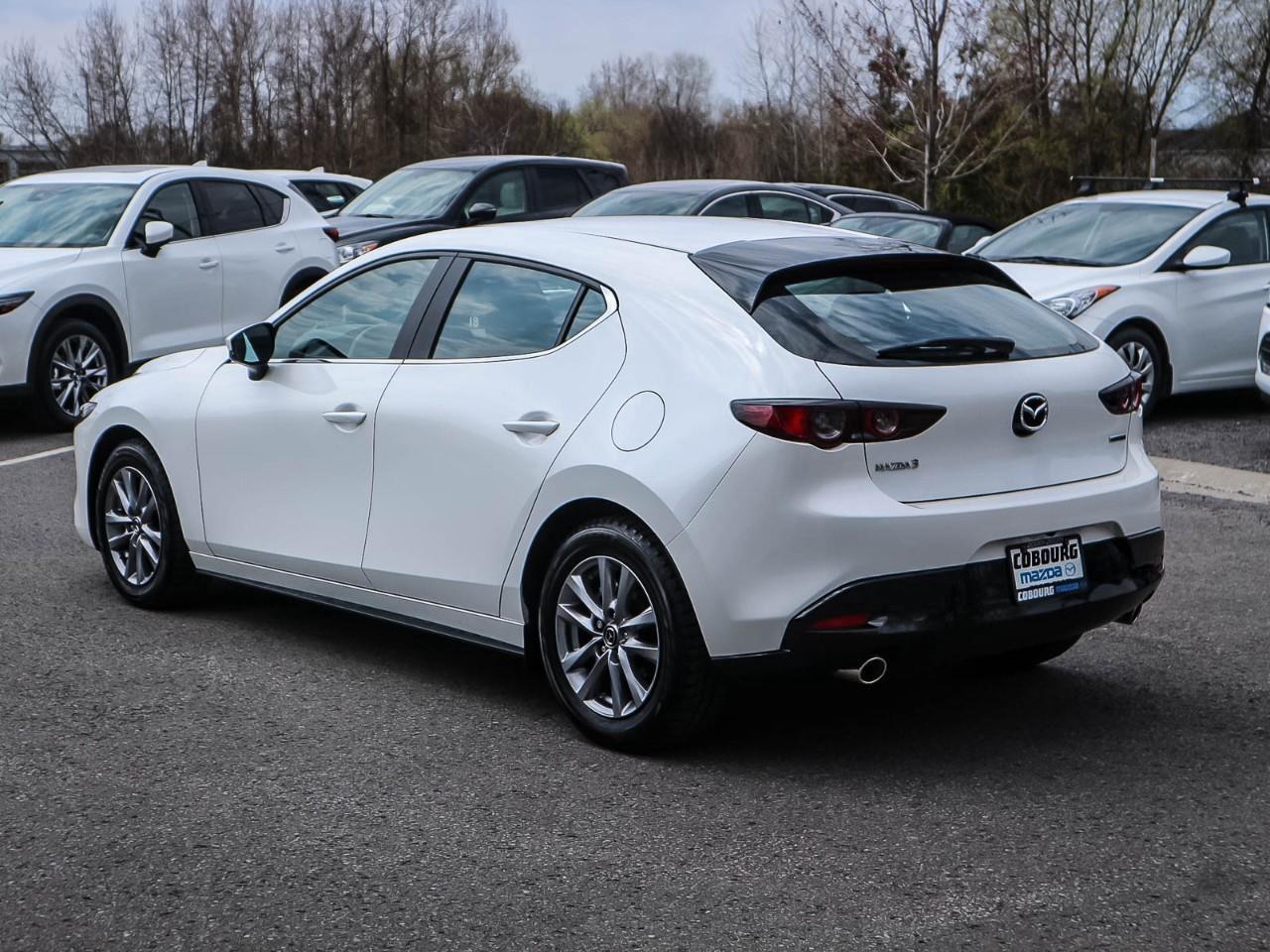 <p>Experience the thrill of driving the 2020 Mazda Mazda3 Sport GS in stunning white, equipped with a manual transmission and front-wheel drive. Designed for those who value dynamic performance and superior handling, this sedan offers a driving experience like no other.</p><p>The sleek exterior, accentuated by stylish alloy wheels, turns heads on every road. Step inside the refined black interior where elegance meets functionality. Comfort and convenience are at the forefront with air conditioning and heated seats ensuring every journey is a pleasure, regardless of the season.</p><p>The 2020 Mazda3 Sport GS is engineered with advanced technology, featuring a backup camera and smart device integration to keep you connected on the go. With Bluetooth connectivity and keyless entry, your drive becomes effortlessly streamlined. Safety is paramount with features like brake assist, lane assist, and a comprehensive suite of driver assistance systems giving you peace of mind on every drive.</p><p>If you're in search of a vehicle that offers style, performance, and intelligent technology, the Mazda3 Sport GS is for you. Perfect for individuals or small families who appreciate a blend of sportiness and practicality, this sedan is calling to be yours. Contact our dealership today for more information and to experience this exceptional vehicle firsthand.</p>
