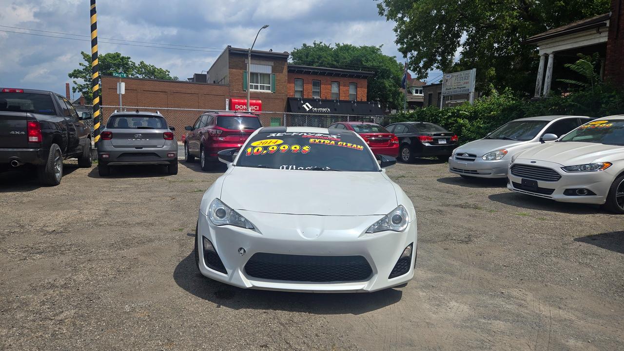 <p class=font-claude-response-body break-words whitespace-normal>2014 Scion FR-S &mdash; $10,999</p><p class=font-claude-response-body break-words whitespace-normal>169,472 km | Automatic | 2.0L Boxer 4-Cylinder DOHC 16V</p><p class=font-claude-response-body break-words whitespace-normal>A true drivers car &mdash; the FR-S pairs a rev-happy boxer engine with sharp, balanced handling. Great looks, great fun behind the wheel, and still turns heads a decade later.</p><p class=font-claude-response-body break-words whitespace-normal>Highlights:</p><ul class=[li_&]:mb-0 [li_&]:mt-1 [li_&]:gap-1 [&:not(:last-child)_ul]:pb-1 [&:not(:last-child)_ol]:pb-1 list-disc flex flex-col gap-1 pl-8 mb-3><li class=font-claude-response-body whitespace-normal break-words pl-2>2.0L Boxer 4-cylinder DOHC 16V engine</li><li class=font-claude-response-body whitespace-normal break-words pl-2>Automatic transmission</li><li class=font-claude-response-body whitespace-normal break-words pl-2>169,472 km</li><li class=font-claude-response-body whitespace-normal break-words pl-2>Sporty coupe styling, rear-wheel drive fun</li></ul><p class=font-claude-response-body break-words whitespace-normal>$10,999 + HST & licensing. Financing available, trades welcome.</p><p class=font-claude-response-body break-words whitespace-normal>M A Auto Sales &mdash; 758 King St. East, Hamilton, ON<br>📞 365-737-2555 | 🌐 maautosales.ca</p><p class=font-claude-response-body break-words whitespace-normal>Message or call/text to book a viewing.</p>