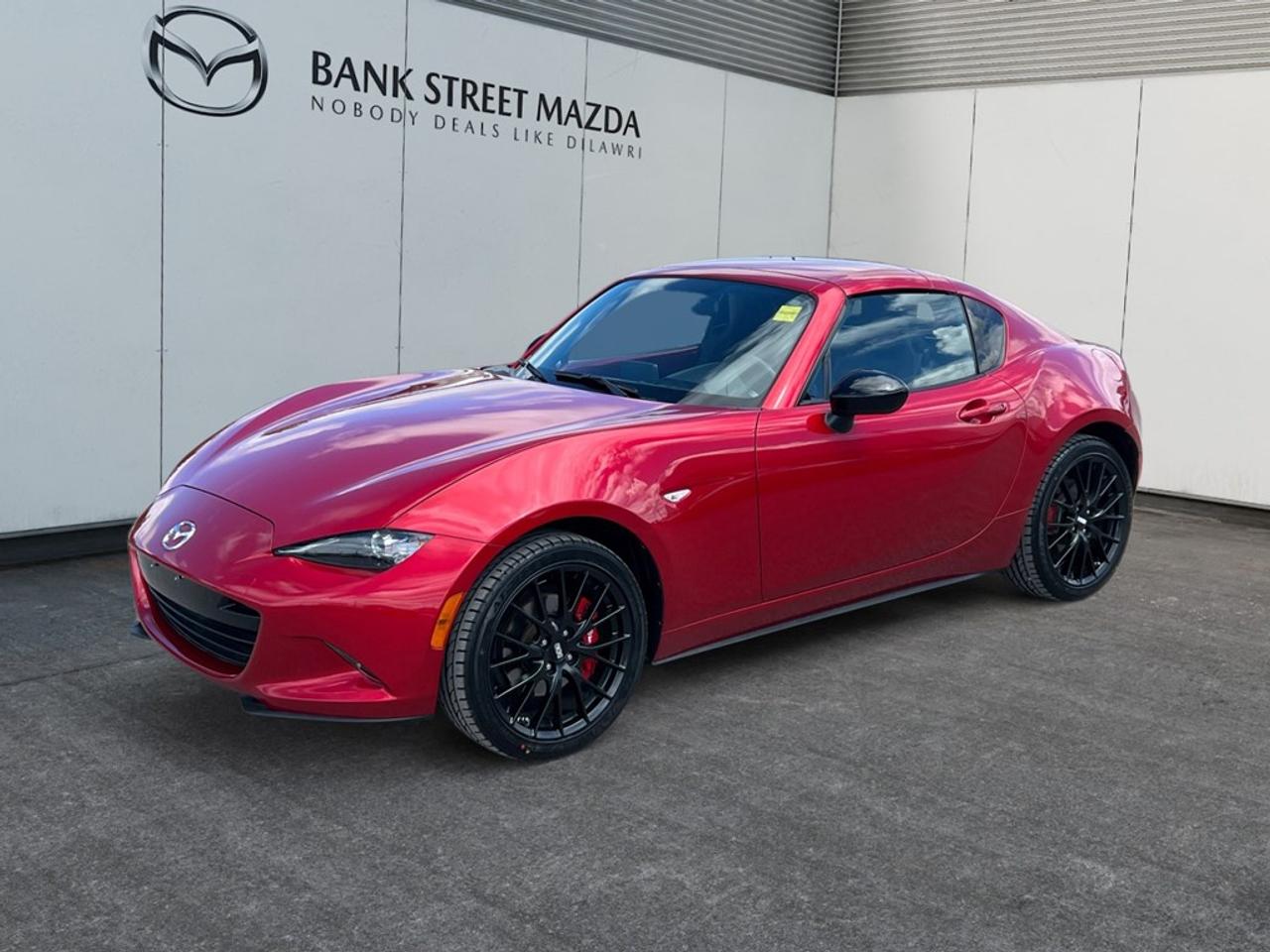 Step into the world of exhilarating performance with the 2017 Mazda MX-5 RF GS, a radiant red convertible that promises to turn heads and stir the soul. With its rear-wheel drive and manual transmission, this car offers an unforgettable drive that connects you to the road like never before. The exterior is both sporty and sophisticated, designed to captivate with its flowing lines and athletic stance. The interior is just as inviting, blending comfort with innovation. Youll appreciate the driver-focused cockpit, where every control is thoughtfully placed to enhance your driving experience. When it comes to technology and safety, the MX-5 RF GS is ahead of the curve. Equipped with features such as a navigation system and Bluetooth connection, staying connected and informed has never been easier. The inclusion of smart device integration ensures that your mobile world is always within reach. Plus, with key safety features like brake assist and lane assist, your driving confidence will be at an all-time high. This model is perfect for car enthusiasts who crave an authentic driving experience with the comforting touch of modern conveniences. Contact our dealership today to learn more about this iconic Mazda MX-5 RF and experience it for yourself.
