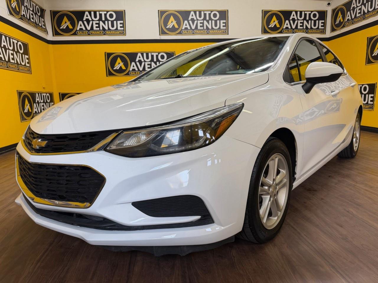 This outstanding example of a 2018 Chevrolet Cruze LT is proudly offered by Auto Avenue Airdrie. <br/> This stylish and reliable sedan perfectly combines modern design, everyday practicality, and impressive fuel efficiency. With exceptionally low mileage, this Chevrolet Cruze has been driven sparingly and carefully maintained, offering outstanding value for its next owner. Its sleek exterior styling and comfortable interior make every drive enjoyable, whether you&rsquo;re commuting through the city or heading out on the highway. <br/> Equipped with sought-after features including heated seats and a backup camera, this Cruze LT delivers the comfort, convenience, and confidence drivers are looking for in a modern vehicle. Smooth handling, excellent efficiency, and Chevrolet&rsquo;s reputation for dependability make this sedan an excellent choice for both new and experienced drivers alike. <br/> There are many vehicles on the market, but few offer the perfect balance of quality, reliability, comfort, and character quite like this Chevrolet Cruze LT. Designed to stand out while remaining practical and affordable, this vehicle truly reflects smart ownership and refined taste. <br/> A remarkable combination of efficiency, technology, and everyday versatility &mdash; this 2018 Chevrolet Cruze LT is more than just a sedan. It&rsquo;s the perfect vehicle for your lifestyle! <br/> AUTO AVENUE IS AN AMVIC LICENSED DEALERSHIP, COMMITTED TO PROVIDING EXCEPTIONAL SERVICE AND QUALITY VEHICLES WITH FLEXIBLE PAYMENT OPTIONS. <br/>