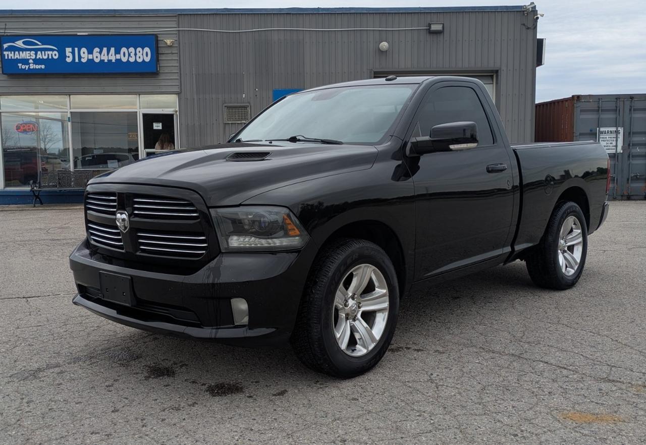 <p class=MsoNormal><span style=font-size: 14.0pt; line-height: 115%;>2015 RAM 1500 Sport 4X4 Regular Cab &ndash; Short Wheelbase! 186,000 kms.</span></p><p class=MsoNormal><span style=font-size: 14.0pt; line-height: 115%;>5.7L HEMI V8 engine & 8-speed transmission</span></p><p class=MsoNormal><span style=font-size: 14.0pt; line-height: 115%;>Short Wheelbase & Sporty stance with 20 wheels and aggressive Sport styling</span></p><p class=MsoNormal><span style=font-size: 14.0pt; line-height: 115%;>Clean, tough, and fun to drive &mdash; this short-bed regular cab Sport is a rare find.</span></p><p class=MsoNormal><span style=font-size: 14.0pt; line-height: 115%;>Power, mirrors, seats and windows. </span></p><p class=MsoNormal><span style=font-size: 14.0pt; line-height: 115%;>Heated seats and steering wheel. A/C blows cold.</span></p><p class=MsoNormal><span style=font-size: 14.0pt; line-height: 115%;>Navigation, back-up camera and cruise control.</span></p><p class=MsoNormal><a name=_Hlk211499882></a><span style=font-size: 14.0pt; line-height: 115%; mso-ascii-font-family: Aptos; mso-hansi-font-family: Aptos;>Clean CARFAX Report. No accidents or damage claims recorded. Fresh oil change, Fully Serviced, Safety Inspected & Certified.</span></p><p class=MsoNormal><span style=mso-bookmark: _Hlk211499882;><span style=font-size: 14.0pt; line-height: 115%; mso-ascii-font-family: Aptos; mso-hansi-font-family: Aptos;>Asking $18,995 + 13% HST and Vehicle Registration/Licencing and OMVIC requirements.</span></span></p><p class=MsoNormal><span style=mso-bookmark: _Hlk211499882;><span style=font-size: 14.0pt; line-height: 115%; mso-ascii-font-family: Aptos; mso-hansi-font-family: Aptos;>Extended Warranty and Financing options are available.</span></span></p><p class=MsoNormal><span style=mso-bookmark: _Hlk211499882;><span style=font-size: 14.0pt; line-height: 115%; mso-ascii-font-family: Aptos; mso-hansi-font-family: Aptos;>Offered by Thames Auto Sales. </span></span><a href=http://www.thamesautosales.ca><span style=mso-bookmark: _Hlk211499882;><span style=font-size: 14.0pt; line-height: 115%; mso-ascii-font-family: Aptos; mso-hansi-font-family: Aptos;>www.thamesautosales.ca</span></span></a><span style=mso-bookmark: _Hlk211499882;><span style=font-size: 14.0pt; line-height: 115%; mso-ascii-font-family: Aptos; mso-hansi-font-family: Aptos;> Now under new ownership and management, effective June 1, 2025.</span></span></p><p class=MsoNormal>&nbsp;</p><p class=MsoNormal>&nbsp;</p>
