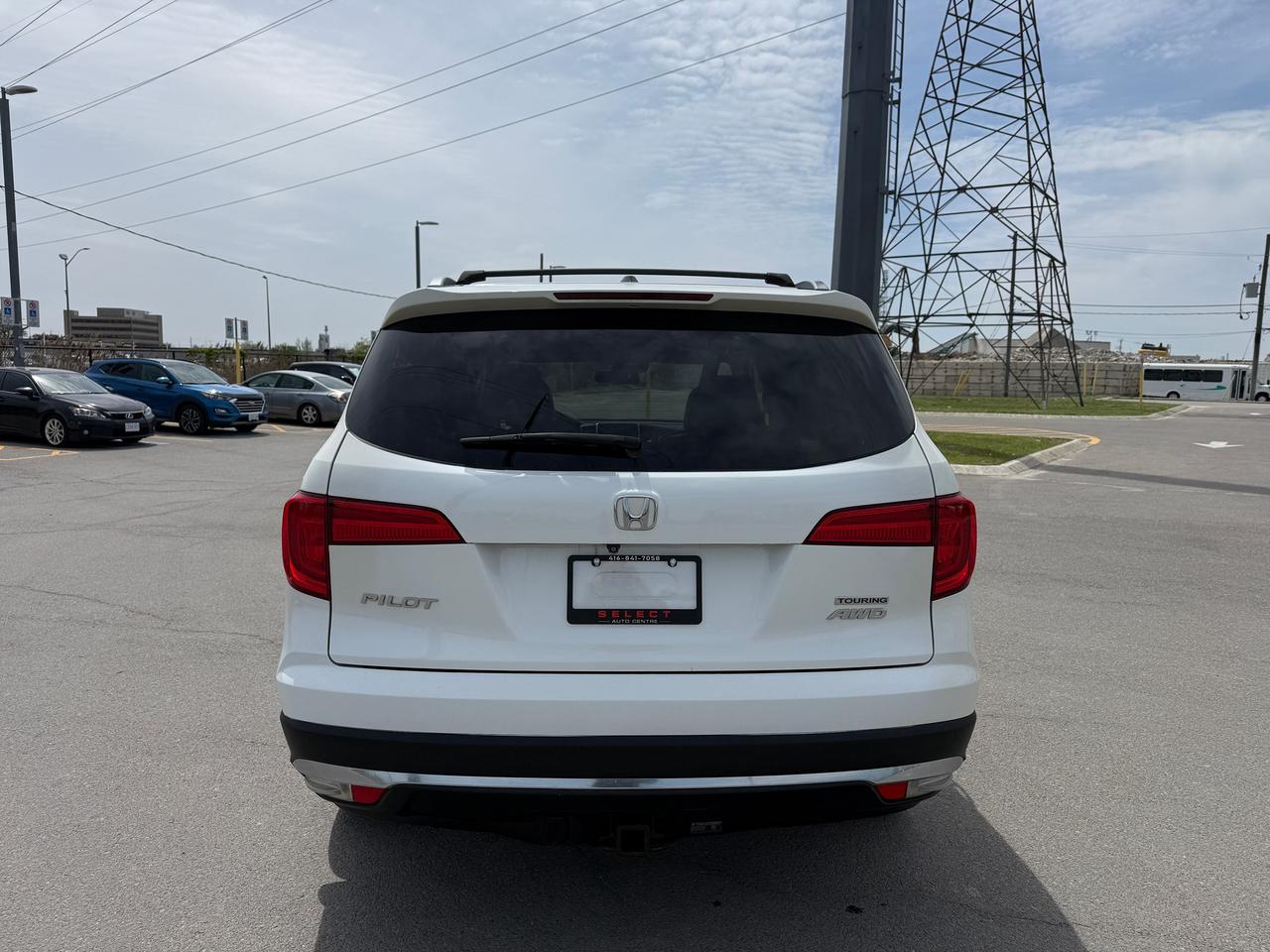 2017 Honda Pilot Touring*CAPTAIN CHAIRS*DVD*NAVI*LOADED* Photo