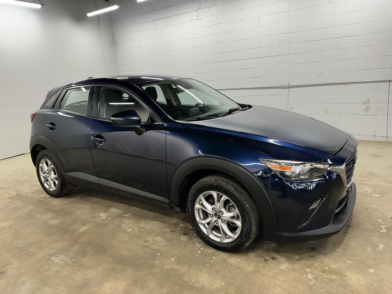 <p>Looking for a stylish and capable compact SUV thats ready for whatever Canadian adventures you have planned? Troys Toys has a fantastic pre-owned 2019 Mazda CX-3 GS that might just be the perfect fit! This eye-catching blue CX-3 boasts a sleek design and a comfortable black interior, making every drive a pleasure. With its all-wheel-drive system and smooth automatic transmission, youll feel confident tackling diverse road conditions, from city commutes to weekend getaways. This well-maintained CX-3 has 137,881 kilometers on the odometer and is eager to embark on its next chapter with you.</p><p>This 2019 Mazda CX-3 GS is more than just a car; its a smart choice for those who appreciate refined design and engaging performance. The popular CX-3 is known for its agile handling and premium feel, often punching above its weight class. Whether youre navigating busy streets or exploring new horizons, this compact SUV offers a sophisticated driving experience thats both practical and fun. Come on down to Troys Toys and see how this versatile Mazda can elevate your daily drive.</p><p>Here are five features of this 2019 Mazda CX-3 GS that are sure to impress:</p><ul><li><strong>All-Wheel Drive Capability:</strong> Conquer Canadian winters and challenging terrain with confidence thanks to the intelligent all-wheel-drive system, providing superior traction and stability in all conditions.</li><li><strong>Agile and Engaging Handling:</strong> Experience the renowned Zoom-Zoom spirit with the CX-3s sporty driving dynamics, offering a responsive and enjoyable ride that makes every turn a delight.</li><li><strong>Sleek and Modern Design:</strong> Turn heads with the CX-3s sophisticated exterior styling and flowing lines, a testament to Mazdas Kodo design philosophy that exudes elegance and athleticism.</li><li><strong>Comfortable and Refined Interior:</strong> Step into a well-appointed cabin featuring a stylish black interior designed for driver comfort and passenger enjoyment, creating a premium atmosphere for every journey.</li><li><strong>Fuel-Efficient Gasoline Engine:</strong> Enjoy an efficient yet spirited drive with the gasoline engine, offering a great balance of power and economy for your daily commutes and longer excursions.</li></ul><p><strong><em>Powered by AutoIntelligence&trade;</em></strong></p><p>Vehicle information has been generated using artificial intelligence and is provided for informational purposes only. While efforts are made to ensure accuracy, please confirm all details directly with the dealer.</p>