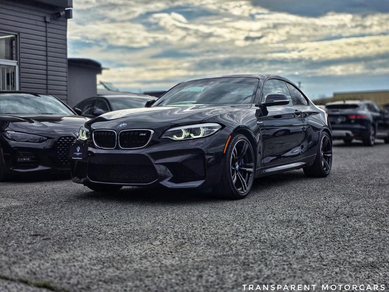 Transparent Motorcars is pleased to offer this beautiful 2018 BMW M2 Black Sapphire Metallic, with 59,258 km. It Features 365 Horsepower 3.0L Turbo Engine Paired With Shiftable Automatic Transmission, 19-inch Y-Spoke M Performance Wheels, Black Chrome Tailpipes, High-Gloss Black Kidney Grills, Carbon Fibre Rear Diffuser, Carbon Fibre Mirror Caps, Adaptive Full LED Headlights, Keyless Start/Entry, Heated Seats/Steering Wheel, Apple CarPlay, Android Auto, And Much More! <br/> <br/> <br/> <br/> <br/> Stock# G000281B Dealer # 50276 <br/> <br/> <br/> <br/> <br/> <br/> <br/> $995 Documentation Fee <br/> <br/> <br/> <br/> <br/> 3 Month Warranty Will Be Provided <br/> <br/> <br/> <br/> <br/> This vehicle has undergone a comprehensive 110-point inspection at our state-of-the-art service facility, covering: Powertrain, Suspension, Tire Tread Depth ,Brake Condition ,All Electrical Components <br/> <br/> <br/> <br/> <br/> <br/> <br/> *Each vehicle comes with a limited warranty for your peace of mind. <br/> <br/> <br/> <br/> <br/> <br/> <br/> *Free, full CARFAX Vehicle History Report available upon request. <br/> <br/> <br/> <br/> <br/> <br/> <br/> *We are a 5-star rated Google dealership, trusted by our customers. <br/> <br/> <br/> <br/> <br/> <br/> <br/> *Thousands of satisfied customers  we invite you to join our automotive family! <br/> <br/> <br/> <br/> <br/> <br/> <br/> *Complimentary pick-up service from the airport, ferry terminal, or SkyTrain station is available. <br/> <br/> <br/> <br/> <br/> <br/> <br/> *For details on our refund and buyback policy, please contact our team directly. <br/> <br/> <br/> <br/> <br/> <br/> <br/> At our dealership, we pride ourselves on building lasting relationships with our customers. Were not just a one-time dealer  we are committed to being your trusted partner for all your vehicle needs, now and in the future. From your initial purchase to ongoing service, we aim to exceed expectations every step of the way. <br/>