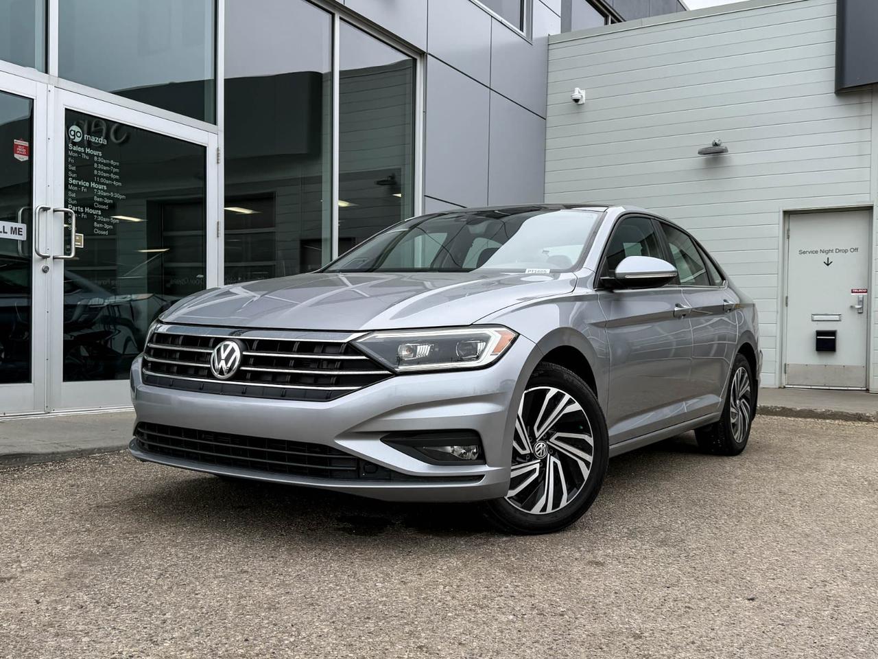 Experience sophistication and efficiency with this pre-owned 2021 Volkswagen Jetta Execline. Finished in sleek Silver, it features a responsive 1.4L TSI 147 HP 4-cylinder engine paired with an 8-speed automatic transmission with Tiptronic for smooth, confident driving. Enjoy premium comfort with heated and ventilated leather sport seats, and immerse yourself in crystal-clear sound from the BeatsAudio premium system.This Jetta is loaded with advanced safety and convenience features, including adaptive cruise control, lane departure prevention, blind spot warning, and a rearview camera for peace of mind on every drive. Stay connected effortlessly with its integrated navigation, dual-zone climate control, wireless smart device charging, and keyless entry with push-button start.Efficient, stylish, and packed with technology, this Jetta Execline offers an exceptional blend of performance and luxury  perfect for your daily drive or weekend adventures. Visit us today to take this standout sedan for a test drive!Go Mazda is an AMVIC licensed businessClean CarFax