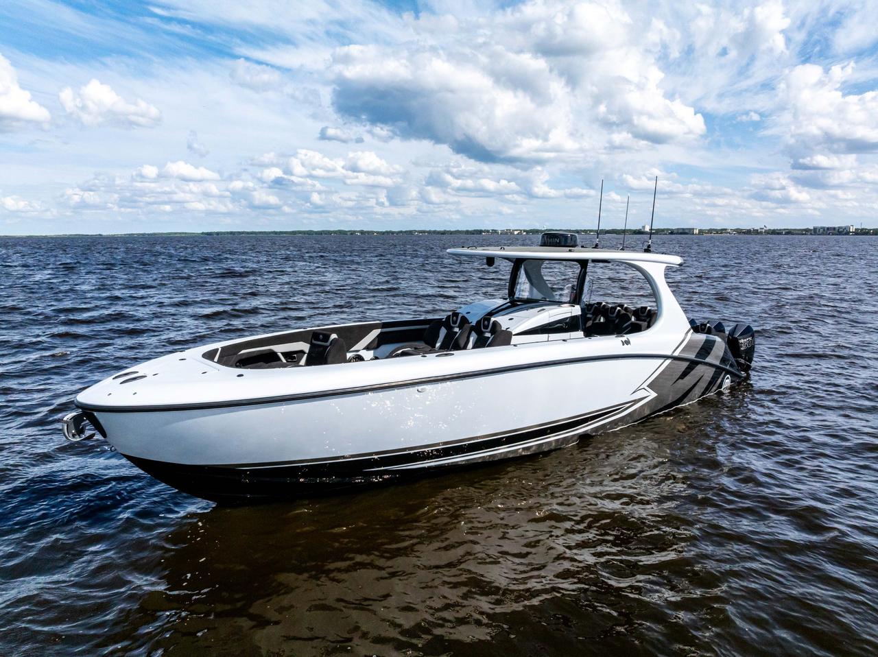 2027 Mystic Powerboats M4200 Center Console High-performance luxury center console is powered by quad 2026 Mercury Racing 500R outboards producing a combined 2,000 HP. Featuring a modified-vee fibreglass hull, joystick control, Seakeeper stabil Photo