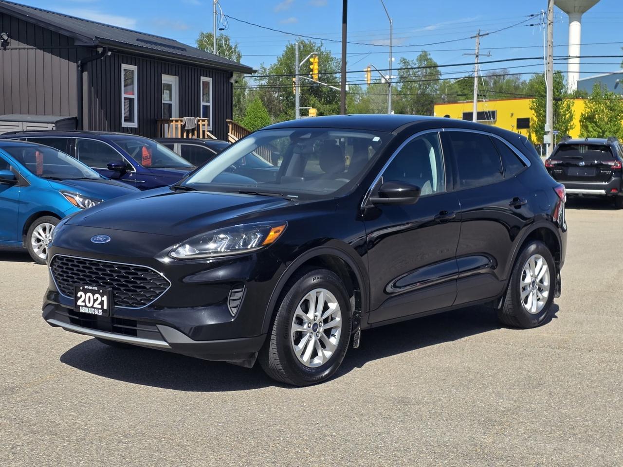 <p>Take on every season with confidence in this 2021 Ford Escape SE AWD! Powered by a fuel-efficient 1.5L EcoBoost 3-cylinder engine, this versatile SUV delivers a smooth and responsive drive while offering the comfort, technology, and safety features todays drivers want most.</p><p>Equipped with Navigation, Back-Up Camera, Blind Spot Monitor, Adaptive Cruise Control, Lane Departure Warning, Lane Keeping Assist, and Rear Collision Mitigation, the Escape helps keep you safe and connected wherever the road takes you. Inside, enjoy Heated Front Seats, Bluetooth, Steering Wheel Controls, Smart Device Integration, Android Auto, and Apple CarPlay for a comfortable and connected driving experience. Additional features include Power Windows, Power Locks, Power Mirrors, and a convenient Power Outlet.</p><p>This well-equipped AWD SUV is ready for your next adventure!</p><p>Call us today to schedule your test drive!<br>Easton Auto Sales 613-561-5172</p><p>OMVIC Certified & UCDA Member<br>Located just minutes from Kingston and Brockville.<br>We pay top dollar for trades!<br>Check out our 5-star Google rating!</p>