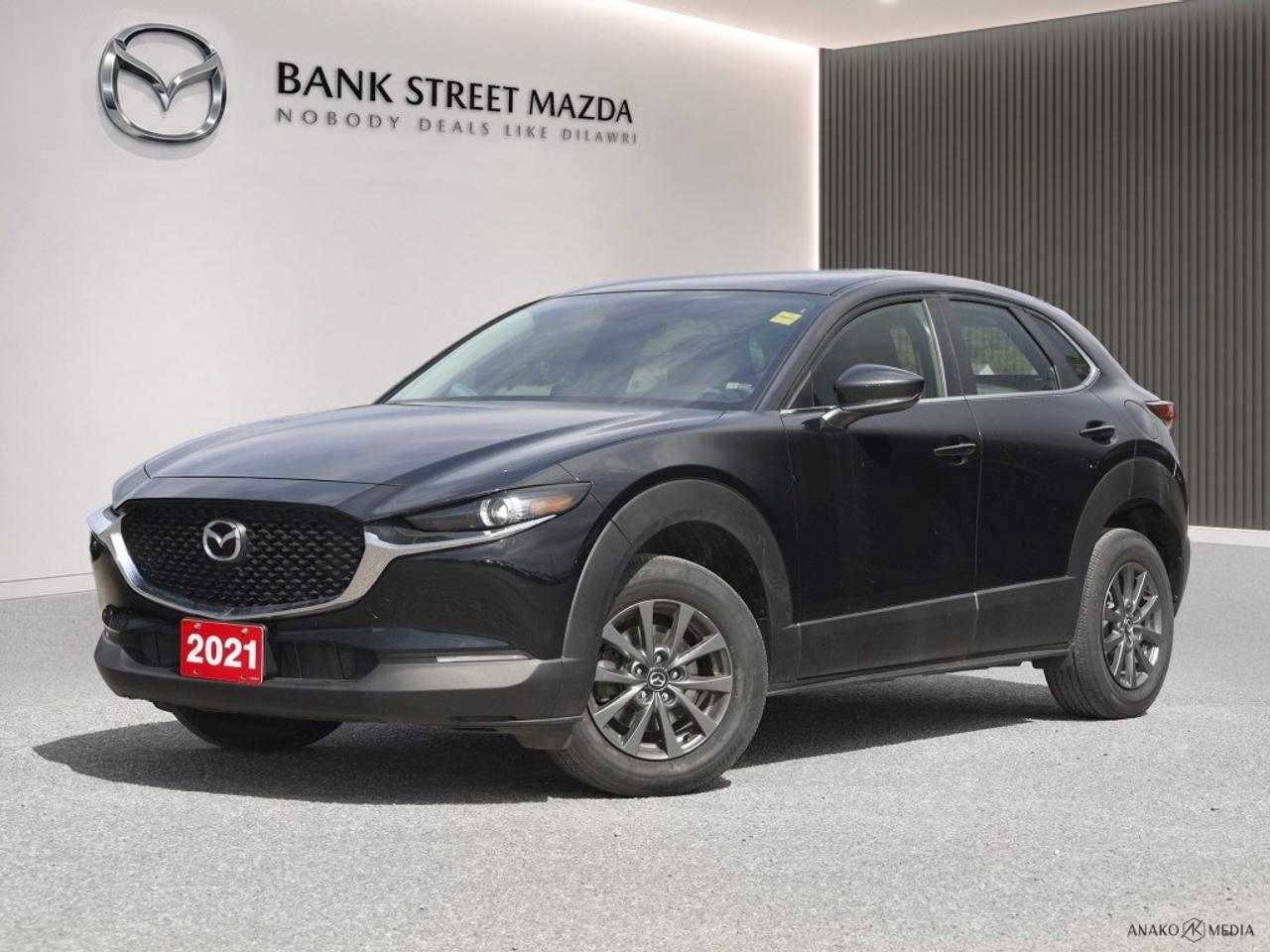 The 2021 Mazda CX-30 GX in a sophisticated finish is a forward-thinking SUV designed for those who appreciate agility and style. With its front-wheel-drive system, this SUV offers responsive handling that ensures a smooth and enjoyable drive. On the outside, the 2021 CX-30 GX presents a striking appearance with alloy wheels that add a touch of elegance to its modern silhouette. Step inside and experience the comfort of heated front seats, complemented by a thoughtfully designed interior featuring leatherette door trim inserts and refined metal-look details on the instrument panel. Equipped with the latest technology, the CX-30 GX includes a backup camera for added safety, Bluetooth connection for seamless communication, and smart device integration to keep you connected on the go. Safety features such as lane assist and brake assist enhance your driving confidence, while convenience features like keyless entry and cruise control elevate your driving experience. This SUV is perfect for those who demand style, technology, and functionality in their vehicle. If youre searching for a reliable and stylish companion, the Mazda CX-30 GX might just be the perfect match. Contact our dealership today to learn more and take it for a spin.