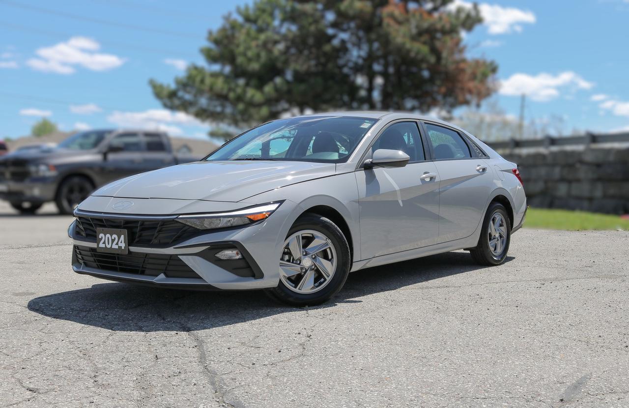 1 KEY FOB, BACKUP CAMERA, BLUETOOTH, HEATED SEATS, LANE KEEP AND MORE !!!

No ordinary compact, our 2024 Hyundai Elantra Essential Sedan blends beauty and brains in Ecotronic Gray! Motivated by a 2.0 Litre 4 Cylinder offering 147hp tethered to a CVT engineered to optimize efficient performance. As a result, this Front Wheel Drive sedan scores approximately 5.7L/100km on the highway with confident acceleration for in-town travel. Our Elantra shows off sharp lines with LED lighting, a chrome grille, power mirrors, and alloy wheels to help you make a bold impression. Its a high-end look that Hyundai owners love!

Our Essential cabin is pretty popular among owners, too. They appreciate its comfortable heated front cloth seats, multifunction steering wheel, manual climate control, power accessories, cruise control, and remote keyless entry for quick access to this versatile interior. Your mobile command center includes an 8-inch touchscreen, a 4.2-inch driver display, voice control, wireless Android Auto&reg;/Apple CarPlay&reg;, Bluetooth&reg;, and an upscale audio system for your favorite soundtrack.

For safer journeys, Hyundai supplies advanced driver assistance from automatic braking, forward collision warning, a rearview camera, lane-keeping assistance, a blind-spot monitor, a driver attention monitor, and more. That means our streamlined Elantra Essential is ready for a starring role on your next trip! Save this Page and Call for Availability. We Know You Will Enjoy Your Test Drive Towards Ownership! 

Bustard Chrysler prides ourselves on our expansive used car inventory. We have over 100 pre-owned units in stock of all makes and models, with the largest selection of pre-owned Chrysler, Dodge, Jeep, and RAM products in the tri-cities. Our used inventory is hand-selected and we only sell the best vehicles, for a fair price. We use a market-based pricing system so that you can be confident youre getting the best deal. With over 25 years of financing experience, our team is committed to getting you approved - whether you have good credit, bad credit, or no credit! We strive to be 100% transparent, and we stand behind the products we sell. For your peace of mind, we offer a 3 day/250 km exchange as well as a 30-day limited warranty on all certified used vehicles.
