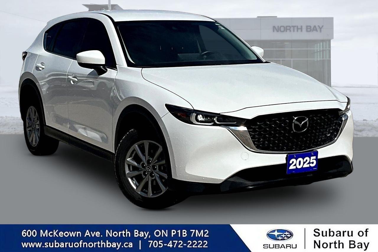 This 2025 Mazda CX-5 GX AWD delivers the perfect blend of athletic performance, upscale craftsmanship, and everyday practicality. Powered by Mazdas proven 2.5L SKYACTIV-G 4-cylinder engine paired with a responsive 6-speed automatic transmission, the CX-5 offers confident acceleration, impressive efficiency, and the engaging driving dynamics that have made Mazda one of the most respected brands in the compact SUV segment.
			Equipped with standard i-Activ AWD, the CX-5 GX is built to handle Canadian weather with confidence while providing a comfortable ride, premium interior quality, and advanced safety technology.
			
			
			Key Features for Drivers:
			
			- 2.5L SKYACTIV-G 4-cylinder engine producing 187 horsepower and 186 lb-ft of torque
			- Smooth and responsive 6-speed automatic transmission
			- Standard i-Activ AWD with predictive traction management
			- Mazda G-Vectoring Control Plus for enhanced handling stability
			- Fuel economy of approximately 10.2 L/100 km city and 8.2 L/100 km highway
			- Comfortable seating for 5 passengers
			- Premium cloth upholstery with supportive front seats
			- Heated front seats with multiple temperature settings
			- Heated steering wheel for added winter comfort
			- Large infotainment display with Mazda Connect interface
			- Apple CarPlay and Android Auto integration
			- Push-button start and keyless entry
			- Dual USB charging ports
			- Automatic LED headlights with automatic on/off function
			- Rear seat fold-down functionality for expanded cargo space
			- Spacious cargo area for groceries, luggage, sports equipment, and outdoor gear
			- Excellent ride quality with quiet cabin refinement
			
			
			Safety & Driver Assistance Features:
			
			- Mazda i-Activsense Safety Suite
			- Advanced Smart City Brake Support
			- Forward Obstruction Warning
			- Autonomous Emergency Braking
			- Lane Departure Warning System
			- Lane-Keep Assist System
			- Driver Attention Alert
			- Blind Spot Monitoring
			- Rear Cross Traffic Alert
			- High Beam Control
			- Additional Safety Features
			- Rearview backup camera
			- Adaptive Cruise Control with Stop & Go functionality
			- Traffic Sign Recognition
			- Dynamic Stability Control (DSC)
			- Traction Control System (TCS)
			- Hill Launch Assist
			- Electronic Brakeforce Distribution (EBD)
			- Anti-lock Braking System (ABS)
			- Tire Pressure Monitoring System (TPMS)
			- Advanced front, side-impact, and side-curtain airbags
			- LATCH child-seat anchor system
			- Reinforced SKYACTIV-Body structure engineered for occupant protection
			 
			
			Awards & Recognition:
			
			- 2025 IIHS Top Safety Pick+ recipient when properly equipped
			- Mazda CX-5 continues to be recognized among the best compact SUVs for safety and reliability
			- Frequently recommended by automotive journalists for its premium interior quality and engaging driving experience
			
			
			All in price - No hidden fees or charges! We pride ourselves on providing a personalized experience for each of our valued customers. We offer a wide selection of vehicles, knowledgeable sales and service staff, complete service and parts centre, and competitive pricing on all of our products. We look forward to seeing you soon. *Every reasonable effort is made to ensure the accuracy of the information listed above, but errors happen. We reserve the right to change or amend these offers. The vehicle pricing, incentives, options (including standard equipment), and technical specifications listed, may not match the exact vehicle displayed. All finance pricing listed is O.A.C (on approved credit). Please confirm with a sales representative the accuracy of this.
			
			Subaru of North Bay has been proudly serving customers in North Bay, Sturgeon Falls, New Liskeard, Cobalt, Haileybury, Kirkland Lake and surrounding areas since 1987. Shop with confidence and visit us today!