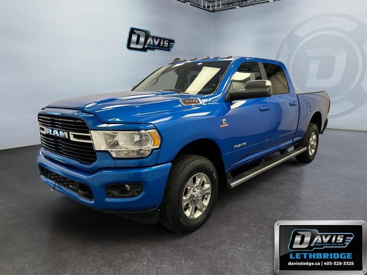 <b>Aux Switches, Parking Sensors, Blind Spot Monitoring<br /> <br /></b><br /> The 2021 Ram 3500 Big Horn Crew Cab 4x4 is built for serious capability, comfort, and style. Powered by the legendary 6.7L Cummins Turbo Diesel engine paired with a 6-speed automatic transmission, this heavy-duty truck delivers impressive towing performance and dependable power for work or recreation. Finished in striking Hydro Blue Pearl Coat with the Sport Appearance Package, this Ram 3500 stands out with body-color bumpers, black exterior accents, polished aluminum wheels, and aggressive styling.<br />Inside the spacious Crew Cab, youll find premium comfort and advanced technology including heated front seats, heated steering wheel, dual-zone automatic climate control, power driver seat with lumbar support, premium cloth bucket seats, and a large 8.4-inch Uconnect touchscreen with Apple CarPlay and Android Auto. The Level 2 Equipment Group adds convenience features like remote start, power-folding heated tow mirrors, ParkSense front and rear park assist, blind spot monitoring, Alpine premium audio, and integrated voice command with Bluetooth connectivity.<br />Designed for towing and all-season capability, this Ram 3500 comes equipped with the Snow Chief Group, 5th wheel/gooseneck towing prep package, trailer brake controller, Class V hitch receiver, anti-spin differential, skid plate shield, spray-in bedliner, deployable bed step, and LED bed lighting. With advanced safety systems including ParkView rear backup camera, trailer sway control, brake assist, hill start assist, and electronic stability control, this diesel-powered Ram delivers the perfect combination of strength, technology, and everyday practicality.<br /><br /> <br />To apply right now for financing use this link: <a href=https://lethbridge.davisdodge.ca/free-credit-check/ target=_blank rel=nofollow noopener noreferrer>https://lethbridge.davisdodge.ca/free-credit-check/</a><br /> <br /><br />Locally Owned & Trusted for Over 35 Years  Davis Dodge in Lethbridge, AB <br /><br /> At Davis Dodge, weve proudly served the Lethbridge community for more than 35 years, offering an unparalleled car buying experience. Dont just take our word for itour Google reviews speak volumes about our commitment to exceptional service. <br /><br /> Delivery & At-Home Test Drives: Convenient options to suit your lifestyle. <br /><br /> Flexible Financing for Everyone: Get the vehicle you need with financing solutions tailored to your situation. <br /><br /> Full Mechanical Inspections & Professional Cleaning: Every vehicle is thoroughly inspected and cleaned before it hits our lot.<br /><br /> We take all makes and models on trade and offer competitive pricing with inventory that changes daily. Whether you're shopping for a Chrysler, Dodge, Jeep, RAM, or FIAT, our AMVIC Licensed dealership makes it easy to browse, buy, and drive away.<br /><br /> Located in Lethbridge, AB, we proudly serve customers in Fort Macleod, Taber, Claresholm, and Coaldale. Shop online or visit us today to experience the best in sales, service, and selection. Standard bank rates apply; taxes are additional.<br /><br /> Vehicle pricing offer shown expires 2026-07-31. <br /> Come by and check out our fleet of 50+ used cars and trucks and 100+ new cars and trucks for sale in Lethbridge. o~o