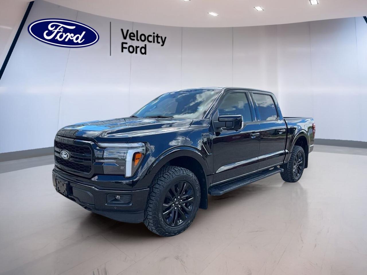 Get ready for a full-size pickup that blends strong capability, premium comfort, and smart everyday usefulness. This used 2025 Ford F-150 LARIAT 4WD SuperCrew 5.5 Box at Velocity Ford in Moose Jaw comes in Black with a Black interior and four full doors for easy access.

Powered by a 3.5-litre unleaded engine and paired with an automatic transmission, this 2025 Ford F-150 LARIAT 4WD SuperCrew 5.5 Box delivers confident power for work, travel, and weekend towing. Four-wheel drive adds extra control in changing road and weather conditions across Saskatchewan.

Inside, this truck is built to make long drives and busy days easier. You get heated front seats, dual-zone climate control, automatic climate control, memory settings, adjustable pedals, and lumbar support for both front occupants. Remote start and push-button start add welcome convenience every time you head out.

FEATURES OF THE F-150 LARIAT 4WD SuperCrew 5.5 Box COMING SOON
»» 3.5-litre unleaded engine with automatic transmission
»» Four-door SuperCrew cab for roomy access
»» Four-wheel drive for added traction
»» 5.5-foot box for versatile utility

TRUCK FEATURES
»» Towing capacity rated at 4,671 kg
»» Rear tow hook supports work-ready utility
»» Side steps help cabin entry
»» Off-road tires add extra grip

ADVANCED SAFETY FEATURES
»» Backup camera helps with reversing confidence
»» Lane departure warning supports safer travel
»» Blind spot monitor aids lane awareness
»» Anti-lock brakes enhance stopping control

PERFORMANCE AND EFFICIENCY
»» 3.5-litre engine delivers strong everyday power
»» Automatic transmission supports smooth shifting
»» Four-wheel drive improves all-season traction
»» Stability control helps maintain road composure

COMFORT AND CONVENIENCE
»» Heated front seats for cold mornings
»» Dual-zone climate control adds comfort
»» Memory seats personalize driving position
»» Remote starter adds everyday convenience

TECHNOLOGY AND CONNECTIVITY
»» Navigation system helps guide every trip
»» Bluetooth integration supports hands-free calling
»» WiFi hotspot keeps devices connected
»» Satellite radio expands entertainment choices

CARGO SPACE
»» 5.5-foot box handles daily hauling
»» Rear trunk access improves loading ease
»» SuperCrew cabin adds interior storage flexibility
»» Spare tire supports travel confidence

WHAT OTHER OWNERS LIKE
»» Strong towing ability for work duties
»» Comfortable cabin for long highway trips
»» User-friendly technology for daily driving
»» Four-wheel drive confidence in winter

This 2025 Ford F-150 LARIAT 4WD SuperCrew 5.5 Box COMING SOONs VIN is: 1FTFW5L85SKE42013.