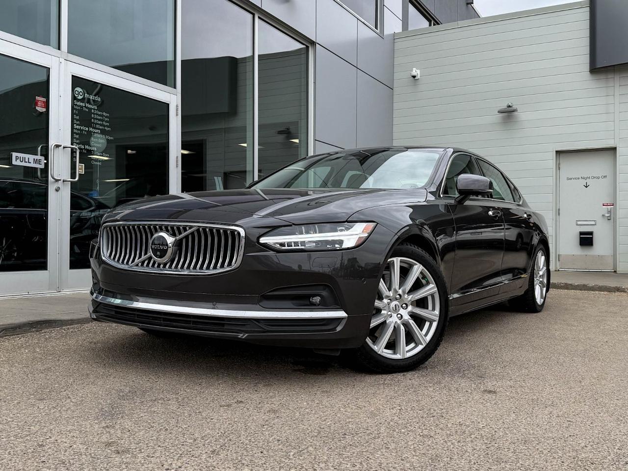 Experience luxury redefined with this pre-owned 2022 Volvo S90 Inscription B6 AWD in elegant Grey. Powered by a smooth and efficient 2.0L turbocharged hybrid engine paired with an 8-speed Geartronic automatic transmission, this sleek sedan delivers responsive all-wheel drive performance with advanced driver-selectable modes.Step inside to premium Nappa leather comfort seats, including heated and ventilated front buckets with 12-way power adjustments and lumbar support. Enjoy rich sound from the Harman/Kardon premium audio system and advanced tech like a 9-inch touchscreen with integrated navigation, adaptive cruise control, and smartphone mirroring.Safety is paramount, featuring Volvos signature suite: seven airbags, lane departure prevention, blind spot warning, pedestrian impact protection, and more. The smooth touring suspension and quiet cabin promise a refined driving experience every time you get behind the wheel.With luxurious wood and aluminum accents, dual-zone climate control, and smart convenience features such as keyless entry, push-button start, and wireless charging, this Volvo S90 combines elegance, technology, and safety. Discover why the S90 Inscription B6 AWD is the perfect harmony of performance and sophistication. Schedule your test drive today!Clean CarFax