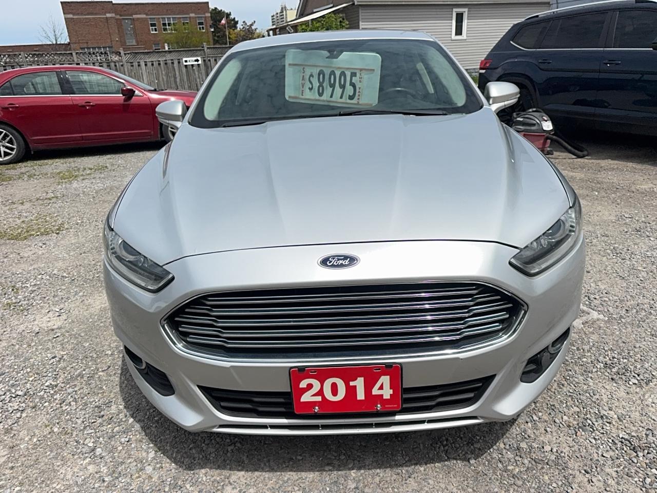<html>
<p>2014 Ford Fusion SE silver with black leather seats one owner clean carfax no accidents reported low mileage comes fully certified Assurant coast to coast 6 months 6000 km $2500 per claim warranty included looks and runs y</p>
</html>