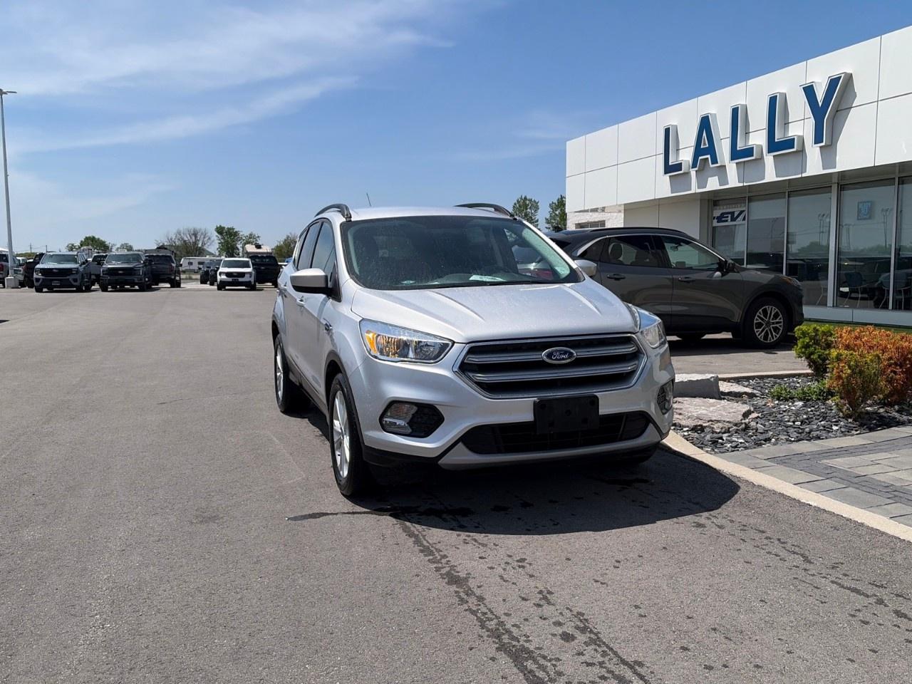 <p>The 2017 Ford Escape SE is a compact SUV that combines practical everyday comfort with solid fuel economy and responsive handling. Equipped with a 4-cylinder engine and a 6-speed automatic transmission, the SE trim commonly features the 1.5-liter EcoBoost turbocharged engine producing about 179 horsepower, offering a smooth ride with good acceleration and up to approximately 30 MPG highway. The interior seats five comfortably and includes modern features for its time such as Bluetooth, a rearview camera, and Fords SYNC infotainment system. Its compact size makes it easy to maneuver while still providing useful cargo space for family or travel needs.</p>