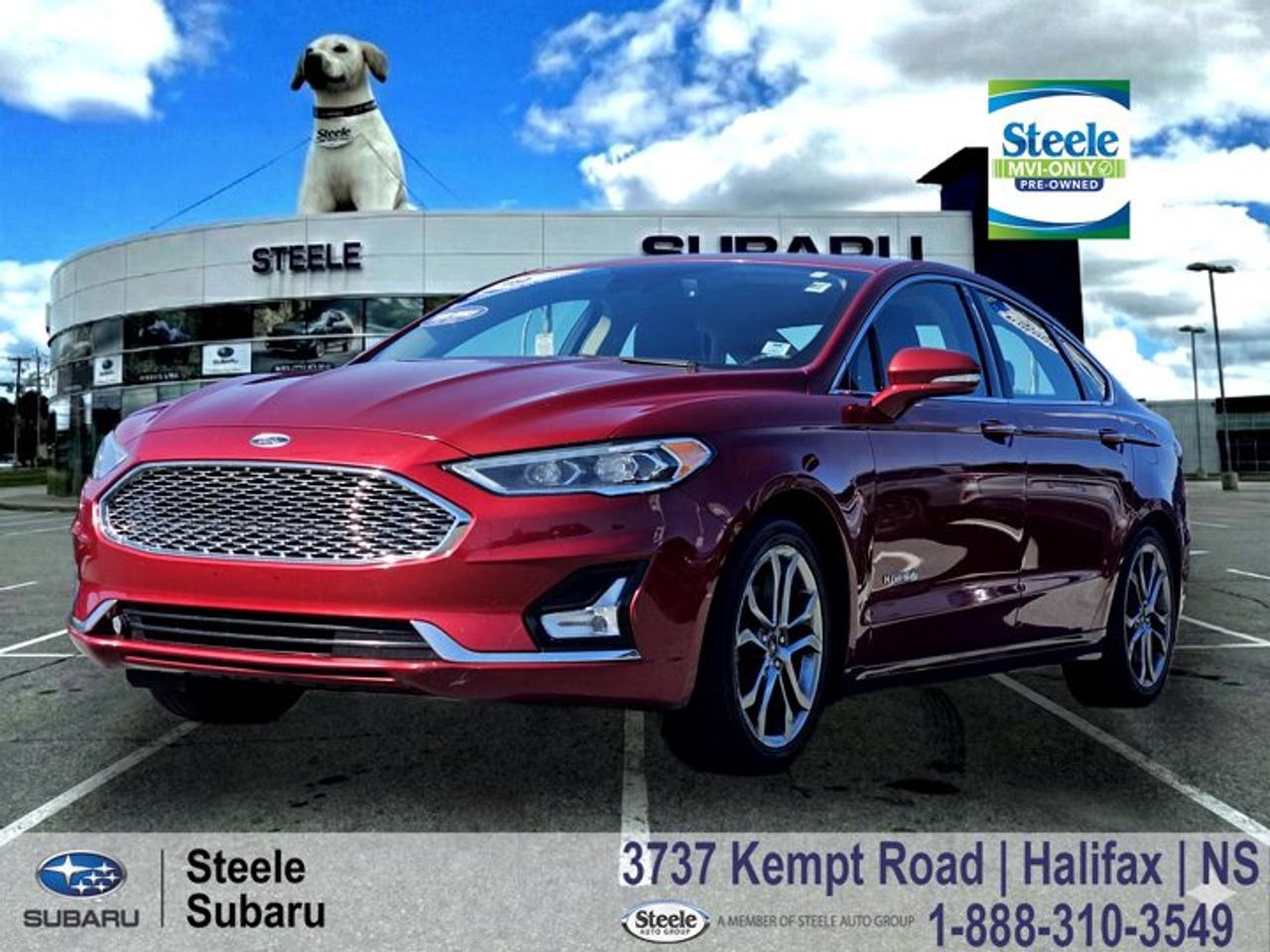 2019 Ford Fusion Titanium Hybrid | Hybrid Efficiency | Leather Interior | Heated Seats | MVI Only | LOWEST PRICE IN CANADA!!!A smart, efficient sedan for Halifax driving, this Fusion Hybrid is just as comfortable on a daily Bedford commute as it is stretching out along Highway 102 on a warm summer evening. Its a practical choice for getting around the city and beyond while keeping fuel stops to a minimum.The Titanium Hybrid sits at the top of the Fusion lineup, blending upscale comfort with excellent fuel efficiency from its 2.0L hybrid powertrain paired to an electronically controlled CVT. Front-wheel drive provides stable, predictable handling on pavement, with a smooth and quiet driving character that suits both city traffic and longer Nova Scotia highway runs. This is a one owner trade-in thats loaded with options and offers real value for a budget-conscious buyer. It has gone through a full multi-point inspection and received fresh service including oil and filter, with front control arms replaced and a completed alignment to tighten up ride quality and steering feel. Tires show solid remaining tread, and while the brake rotors show some scoring, they perform smoothly. With a valid two-year MVI already completed, its a known, ready-to-drive option for someone looking to get on the road this season without major upfront guesswork.Performance & SafetyFront-wheel drive2.0L hybrid engine with eCVTElectronic Stability ControlTraction Control SystemAnti-lock braking systemAdvanced airbag systemRearview cameraComfort & TechHeated front seatsLeather-trimmed seatingTouchscreen infotainment systemBluetooth connectivityDual-zone automatic climate controlKeyless entry with push-button startPower drivers seatCruise controlIf youre looking for a comfortable, fuel-efficient daily driver, this Fusion Hybrid is a practical fit. Contact Steele Subaru in Halifax to schedule a test drive and see if it suits your everyday commute or summer driving plans.MVI ONLYThis vehicle is part of our MVI Only Used Cars inventory an affordable option for buyers who dont mind a little elbow grease. Like a fixer-upper home, these vehicles might need some TLC after purchase, but theyve all been fully inspected and come with a valid 2-year Nova Scotia Motor Vehicle Inspection (MVI). A copy of the inspection report and a list of any recommended or required work will be provided. We also include a Carfax Vehicle History Report for full transparency. These vehicles are priced for immediate sale and offer a great opportunity for the right buyer to get on the road at a budget-friendly price.Disclaimer: While every effort has been made to identify and disclose known or visible issues during our inspection process, additional repairs may be required. Symptoms such as warning lights, abnormal noises (including squeaks, rattles, or whines), or performance concerns may require further diagnosis. Please note that sealed components such as engines, transmissions, and clutches are not dismantled or internally inspected. It is the sole responsibility of the purchaser to address any repairs or maintenance needs beyond those required to meet the standards of a valid Nova Scotia Motor Vehicle Inspection (MVI). We also recommend that purchasers obtain an independent inspection of the vehicle prior to purchase.I4 Hybrid, 12 Speakers, Alloy wheels, AppLink/Apple CarPlay and Android Auto, Auto High-beam Headlights, Automatic temperature control, CD player, Emergency communication system: SYNC 3 911 Assist, Fully automatic headlights, Heated steering wheel, Heated/Cooled Leather Front Sport Seats, Memory seat, Navigation System, Power driver seat, Power moonroof, Power passenger seat, SYNC 3 Communications & Entertainment System.