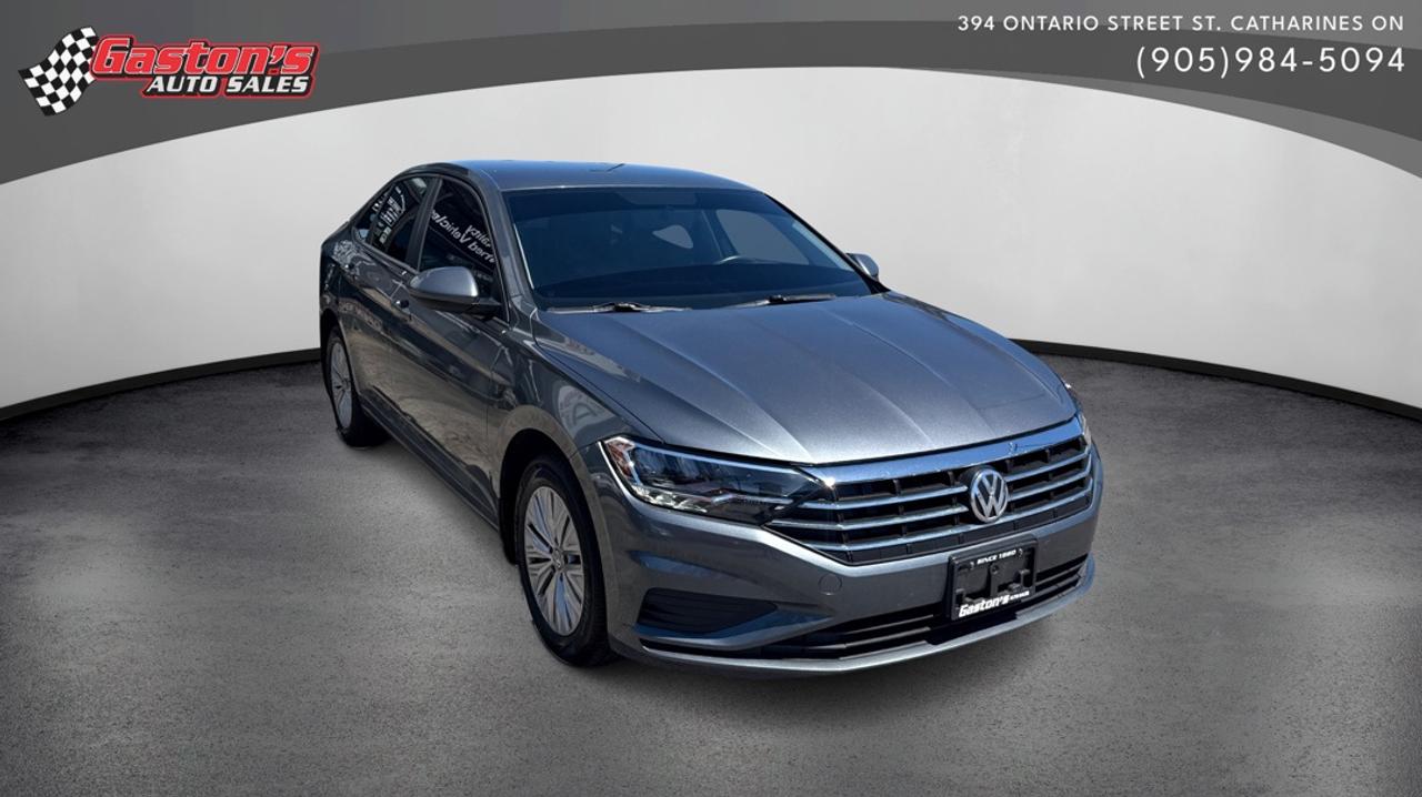 <p class=mb-3 last:mb-0><strong>Experience reliable German engineering that wont break the bank.</strong></p><p class=mb-3 last:mb-0>&bull; Advanced safety features including ABS and traction control for confident driving in any condition<br>&bull; Comfortable cloth seating with heated front seats perfect for cold mornings<br>&bull; Convenient reverse camera eliminates guesswork when backing up<br>&bull; Cruise control and power steering make long drives effortless<br>&bull; Climate-controlled cabin with air conditioning and rear defrost<br>&bull; Complete power package: windows, locks, and mirrors at your fingertips</p><p class=mb-3 last:mb-0>This 2019 Jetta delivers the perfect balance of comfort and practicality. The reverse camera takes the stress out of parking, while the heated front seats and air conditioning ensure youre always comfortable regardless of the season. Cruise control transforms highway drives into relaxing experiences, letting you maintain speed without constant pedal pressure. Combined with responsive power steering, you get a car thats genuinely enjoyable to drive day after day.</p><p class=mb-3 last:mb-0><strong>Perfect for professionals and families who want dependable transportation without luxury car pricing.</strong>&nbsp;Whether youre commuting to the office, running errands around town, or taking weekend road trips, this Jetta adapts to your lifestyle. The practical cloth seats are easy to clean, the intuitive controls are simple to master, and the fuel-efficient design keeps your wallet happy. You get a vehicle thats focused on what matters: getting you where you need to go safely, comfortably, and affordably.</p><ul><li>NEW BRAKES AND ROTORS, TRANSMISSION FLUID SERVICE AND SYNTHETIC OIL CHANGE WITH PURCHASE*</li><li>*** View our full inventory at gastonsautosales.com ***CARFAX VERIFIED!*** *** FAMILY OWNED AND OPERATED SINCE 1980! PLEASE CALL FOR FINANCING OUR FINANCE DEPARTMENT WILL WORK HARD TO GET YOU THE BEST RATE AND BEST TERM (OAC) *** WE SERVICE WHAT WE SELL! IF WE DO NOT HAVE THE VEHICLE OF YOUR CHOICE ON OUR LOT, ASK DANNY AND HE WILL FIND IT FOR YOU ABSOLUTELY NO OBLIGATIONS! ***Thumbnail author:<br><a href=&rdquo;http://www.freepik.com&rdquo;>Designed by starline / Freepik</a></li></ul>