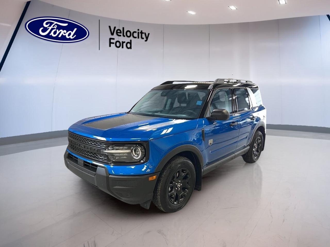 Meet the brand new 2026 Ford Bronco Sport Big Bend 4x4 at Velocity Ford in Moose Jaw. This compact SUV pairs everyday ease with true go-anywhere confidence. Its Blue exterior and Black interior give it a clean, modern look, while four doors and an automatic transmission make daily use simple.

Powered by a 1.5-litre unleaded engine, the 2026 Ford Bronco Sport Big Bend 4x4 delivers a smart balance of useful power and practical efficiency. Four-wheel drive adds extra grip for changing Prairie weather, gravel roads, and winter streets. It is built for drivers who want comfort, control, and flexibility.

FEATURES OF THE Bronco Sport Big Bend 4x4
»» Blue exterior with bold SUV presence
»» 1.5-litre engine with automatic transmission
»» Four-wheel drive for added traction
»» Brand new condition at Velocity Ford

ADVANCED SAFETY FEATURES
»» Backup camera helps with tight parking
»» Lane departure warning adds extra awareness
»» Blind spot monitor supports safer lane changes
»» Side and head airbags boost protection

The 2026 Ford Bronco Sport Big Bend 4x4 is equipped with key safety features that help support peace of mind on every trip. Anti-lock braking system, stability control, child safety locks, and tire pressure monitoring all work together to help keep this SUV ready for daily driving.

PERFORMANCE AND EFFICIENCY
»» 1.5-litre unleaded engine balances power efficiently
»» Eight-speed automatic supports smooth shifting
»» Four-wheel drive improves year-round confidence
»» Power steering aids easy low-speed control

This 2026 Ford Bronco Sport Big Bend 4x4 is made for real Canadian driving. The eight-speed automatic transmission helps deliver smooth response, while cruise control supports relaxed highway travel. It is a smart choice for drivers who want a capable SUV that stays easy to manage.

COMFORT AND CONVENIENCE
»» Heated front seats add winter comfort
»» Automatic climate control keeps cabin pleasant
»» Power windows simplify everyday operation
»» Driver lumbar support improves long drives

Inside, the 2026 Ford Bronco Sport Big Bend 4x4 offers a useful and comfortable cabin. Front air conditioning, an adjustable steering wheel, push button start, automatic door locks, and heated mirrors all help make every trip easier in Moose Jaw and beyond.

TECHNOLOGY AND CONNECTIVITY
»» Bluetooth integration supports hands-free calling
»» WiFi hotspot keeps devices connected
»» Satellite radio expands entertainment choices
»» Steering wheel audio controls add ease

The 2026 Ford Bronco Sport Big Bend 4x4 keeps key functions close at hand. LED headlamps add clear lighting, automatic headlights help in changing conditions, and the cabin includes practical touches like illuminated vanity mirrors and ambient lighting for a refined feel.

CARGO SPACE
»» Rear trunk access makes loading easier
»» Four-door layout supports daily practicality
»» Flexible SUV design suits active lifestyles
»» Useful cargo room for errands

The 2026 Ford Bronco Sport Big Bend 4x4 is ready for groceries, gear, and weekend plans. Its rear cargo area is easy to access, and the SUV shape gives you the versatility many drivers want for work, family use, and day-to-day travel around Saskatchewan.

WHAT OTHER OWNERS LIKE
»» Confident four-wheel drive in poor weather
»» Easy-to-use controls for daily driving
»» Comfortable ride with heated front seats
»» Practical cargo space for busy lifestyles

This 2026 Ford Bronco Sport Big Bend 4x4s VIN is: 3FMCR9BN2TRE51740.