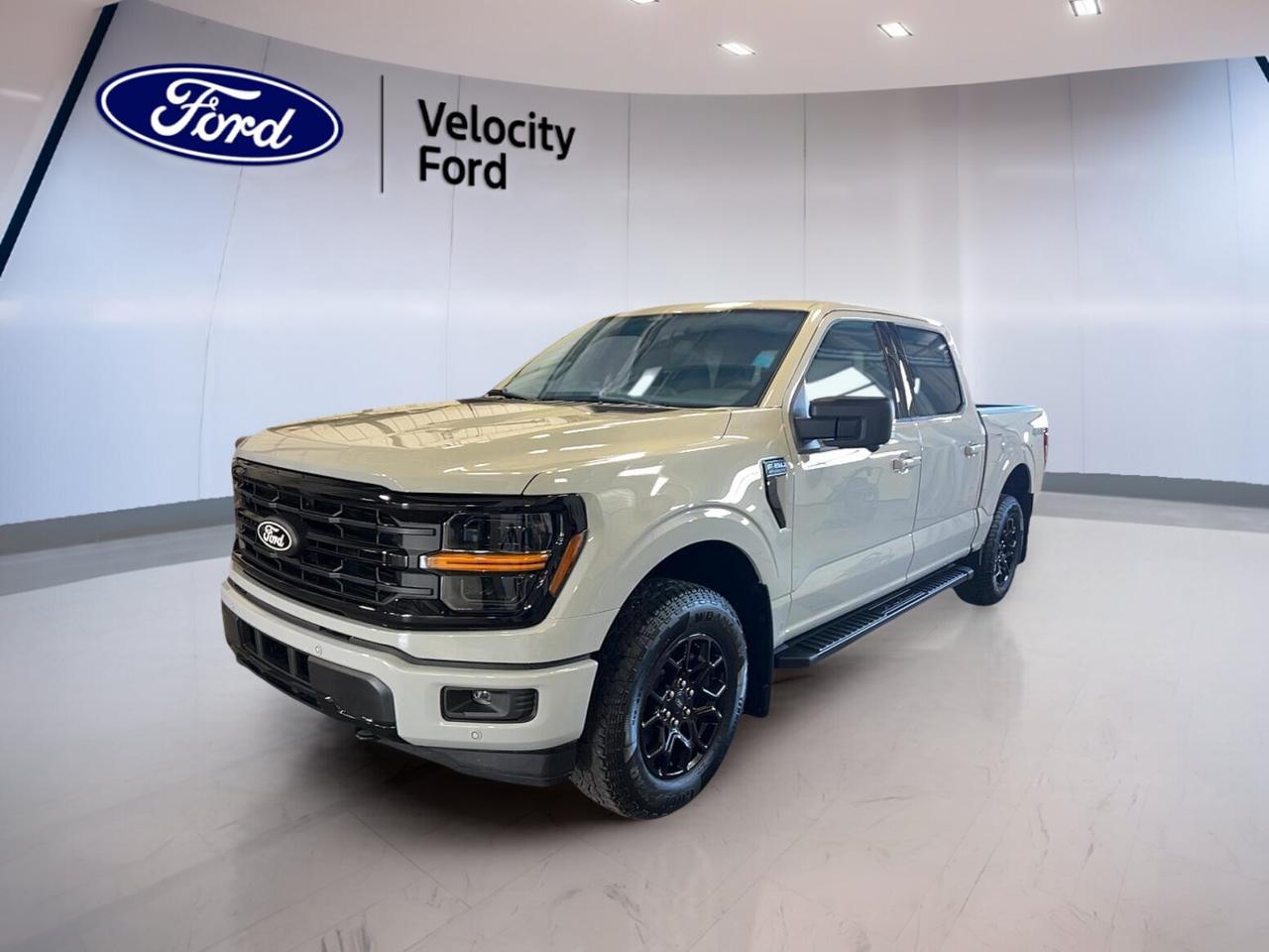 Meet the brand new 2026 Ford F-150 XLT 4WD SuperCrew 5.5 Box, now available at Velocity Ford in Moose Jaw. Finished in White with a Black interior, this four-door pickup blends everyday comfort, proven capability, and modern tech in one smart package. Its 2.7-litre unleaded engine and automatic transmission deliver smooth power for work or weekend use.

Built for Canadian roads and changing weather, this 2026 Ford F-150 XLT 4WD SuperCrew 5.5 Box gives you confident four-wheel drive traction, helpful driver-assist features, and a roomy SuperCrew cabin. It is a brand new truck that feels ready for towing, commuting, and family duty from day one.

FEATURES OF THE F-150 XLT 4WD SuperCrew 5.5 Box
»» Brand new full-size Ford pickup
»» SuperCrew cab with four full doors
»» 5.5-foot box for daily versatility
»» 4WD confidence for year-round driving

TRUCK FEATURES
»» Tows up to 4,671 kg confidently
»» Rear tow hook supports truck utility
»» Off-road tires add extra traction
»» Short box aids easy urban parking

ADVANCED SAFETY FEATURES
»» Backup camera helps reverse with ease
»» Blind spot monitor boosts lane awareness
»» Lane departure warning adds confidence
»» Side and head airbags enhance protection

The 2026 Ford F-150 XLT 4WD SuperCrew 5.5 Box is equipped with key safety features that matter in daily driving. Anti-Lock Braking System, stability control, child safety locks, tire pressure monitoring, and automatic headlights all work together to help support safer travel in city traffic and on the highway.

PERFORMANCE AND EFFICIENCY
»» 2.7-litre unleaded engine balances power
»» Automatic transmission shifts smoothly daily
»» Dual shift mode adds control
»» Four-wheel drive improves slippery-road traction

This 2026 Ford F-150 XLT 4WD SuperCrew 5.5 Box is designed to handle real tasks without feeling heavy in normal driving. Power steering helps keep it easy to manoeuvre, while the automatic transmission and responsive turbocharged engine setup support confident acceleration and useful everyday efficiency.

COMFORT AND CONVENIENCE
»» Front air conditioning keeps cabin comfortable
»» Cruise control supports relaxed highway travel
»» Power windows add daily ease
»» Driver lumbar support improves comfort

Inside, the 2026 Ford F-150 XLT 4WD SuperCrew 5.5 Box offers practical comfort for both driver and passengers. Heated power mirrors, automatic door locks, tinted windows, rear window defroster, adjustable steering wheel, and illuminated vanity mirrors all add convenience you will appreciate through every season.

TECHNOLOGY AND CONNECTIVITY
»» Bluetooth integration supports hands-free calling
»» Wi-Fi hotspot keeps devices connected
»» Satellite radio expands entertainment choices
»» Steering wheel audio controls simplify use

The 2026 Ford F-150 XLT 4WD SuperCrew 5.5 Box keeps daily driving simple with useful tech that is easy to access. The backup camera improves visibility, while Bluetooth and steering wheel controls help you stay focused. LED headlamps and fog lights also improve visibility in poor weather.

CARGO SPACE
»» 5.5-foot box handles daily cargo
»» Rear trunk access aids loading
»» Spare tire supports peace of mind
»» SuperCrew cabin adds secure storage

With its practical bed size and spacious cabin, the 2026 Ford F-150 XLT 4WD SuperCrew 5.5 Box is ready for tools, gear, groceries, and travel bags. The short box is easy to manage in town, yet still useful for many hauling needs around work sites or weekend projects.

WHAT OTHER OWNERS LIKE
»» Strong towing for everyday truck tasks
»» Spacious cabin for family-friendly comfort
»» User-friendly tech and simple controls
»» Confident four-wheel drive capability

This 2026 Ford F-150 XLT 4WD SuperCrew 5.5 Boxs VIN is: 1FTEW3LP9TKD79670.