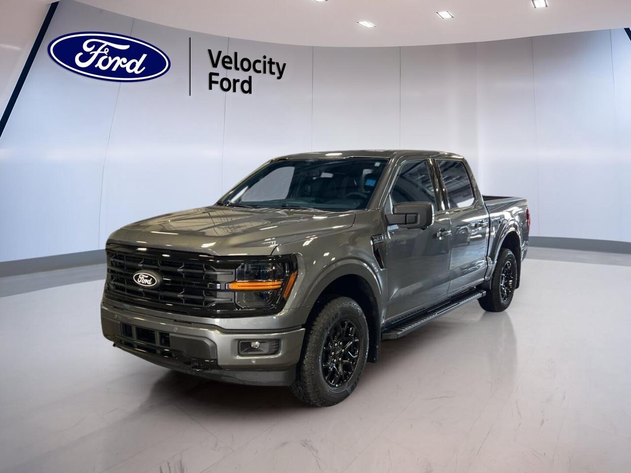 Meet the brand new 2026 Ford F-150 XLT 4WD SuperCrew 5.5 Box at Velocity Ford in Moose Jaw. Finished in Grey with a Black interior, this four-door pickup blends everyday comfort with proven truck strength. Its 2.7-litre unleaded engine and automatic transmission deliver smooth power for work, travel, and weekend towing.

Built for Canadian roads and changing weather, the 2026 Ford F-150 XLT 4WD SuperCrew 5.5 Box gives you confident four-wheel drive, useful driver-assist features, and a roomy cab. This truck keeps things practical and easy to use, with the key features drivers want most in a modern full-size pickup.

FEATURES OF THE F-150 XLT 4WD SuperCrew 5.5 Box
»» SuperCrew cab adds roomy rear seating
»» Four-wheel drive supports year-round traction
»» 5.5-foot box suits daily hauling
»» XLT trim balances value and utility

TRUCK FEATURES
»» Tows up to 4,671 kg confidently
»» Rear tow hook adds work-ready utility
»» Off-road tires support rougher surfaces
»» Short box helps easier urban parking

ADVANCED SAFETY FEATURES
»» Backup camera helps with reversing visibility
»» Blind spot monitor supports lane awareness
»» Lane departure warning adds driving confidence
»» Side and head airbags enhance protection

PERFORMANCE AND EFFICIENCY
»» 2.7-litre unleaded engine balances power efficiently
»» Automatic transmission delivers smooth daily driving
»» Dual shift mode adds driver control
»» Four-wheel drive improves traction on demand

COMFORT AND CONVENIENCE
»» Cruise control supports relaxed highway travel
»» Front air conditioning keeps cabin comfortable
»» Driver lumbar support aids longer trips
»» Power windows add everyday convenience

TECHNOLOGY AND CONNECTIVITY
»» Bluetooth integration supports hands-free calling
»» WiFi hotspot keeps devices connected
»» Satellite radio expands entertainment choices
»» Steering wheel audio controls simplify use

CARGO SPACE
»» 5.5-foot box handles daily cargo needs
»» Rear trunk access eases loading tasks
»» Four-door cabin adds flexible storage room
»» Spare tire supports travel peace

WHAT OTHER OWNERS LIKE
»» Strong towing ability for everyday tasks
»» Comfortable cabin with useful rear space
»» Easy-to-use tech for daily driving
»» Confident four-wheel drive in poor weather

The Grey exterior gives this brand new 2026 Ford F-150 XLT 4WD SuperCrew 5.5 Box a clean, modern look, while heated power mirrors, fog lights, tinted windows, and LED headlamps add useful function. Automatic headlights help reduce effort during changing light conditions, making daily driving simpler.

Inside, the Black cabin is designed for comfort and function. The 2026 Ford F-150 XLT 4WD SuperCrew 5.5 Box includes cloth seating, an adjustable steering wheel, illuminated vanity mirrors, rear window defroster, and automatic door locks. These practical touches help make every trip more comfortable for both driver and passengers.

This truck also brings key safety basics that matter every day. Anti-Lock Braking System, stability control, tire pressure monitoring, child safety locks, passenger airbag sensor, and multiple airbags work together to support peace of mind. Power steering helps keep the 2026 Ford F-150 XLT 4WD SuperCrew 5.5 Box easy to handle in town or on the highway.

For drivers who need a new truck that can tow, carry, and commute without fuss, this Ford is a smart fit. It offers the size, traction, and useful equipment many buyers want, without overcomplicating the experience. Visit Velocity Ford in Moose Jaw and see how well this pickup fits your daily routine.

This 2026 Ford F-150 XLT 4WD SuperCrew 5.5 Boxs VIN is: 1FTEW3LP6TKD82736.