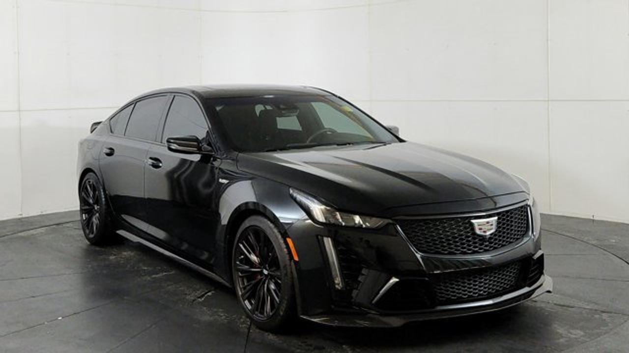 The 2022 Cadillac CT5-V Blackwing is a high-performance luxury sports sedan powered by a hand-built supercharged 6.2-liter V8 engine producing 668 horsepower. It features track-focused engineering such as Magnetic Ride Control suspension, an electronic limited-slip differential, high-performance Brembo brakes, and the choice of a rare six-speed manual or a 10-speed automatic transmission. Inside, it blends performance with luxury through premium materials, advanced infotainment with a touchscreen and AKG audio system, and a full suite of modern driver-assistance and safety technologies.
