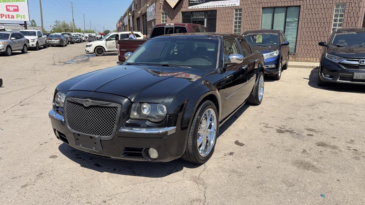 <p class=MsoNormal>This 2005 Chrysler 300 is a timeless, well-maintained sedan with only 187568 km on the odometer. Dressed with an elegant black exterior paired with a beige interior allow for up to 5 passengers to ride in style. Leather seats, power outlets, cruise control, and many other great features allow for comfort and convenience with every drive. This RWD, fully-certified vehicle is a great and practical car for all.&nbsp;</p><p class=MsoNormal>Financing is available for all credit types OAC. Carfax provided for every vehicle.</p><p class=MsoNormal>Prices include certification of vehicle, first oil change, and professional detailing; taxes and licensing extra.</p><p class=MsoNormal>3-month warranty included, can be extended for additional cost. Inquire for more details.</p><p class=MsoNormal>Family-run business with friendly staff. Our customers are our number one priority. Satisfaction guaranteed.</p><p>&nbsp;</p><p class=MsoNormal><strong>C.L.S Auto Sales</strong>&nbsp;2795 Barton St. E., Hamilton, ON, L8E 2J8. <br>Office #: 905-561-8030<span style=mso-tab-count: 1;>&nbsp;&nbsp;&nbsp;&nbsp;&nbsp;&nbsp;&nbsp;&nbsp;&nbsp; </span>After-Hours #: 905-517-4507</p>