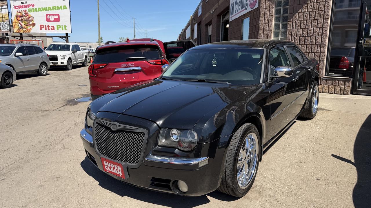 <p class=MsoNormal>This 2005 Chrysler 300 is a timeless, well-maintained sedan with only 187568 km on the odometer. Dressed with an elegant black exterior paired with a beige interior allow for up to 5 passengers to ride in style. Leather seats, power outlets, cruise control, and many other great features allow for comfort and convenience with every drive. This RWD, fully-certified vehicle is a great and practical car for all.&nbsp;</p><p class=MsoNormal>Financing is available for all credit types OAC. Carfax provided for every vehicle.</p><p class=MsoNormal>Prices include certification of vehicle, first oil change, and professional detailing; taxes and licensing extra.</p><p class=MsoNormal>3-month warranty included, can be extended for additional cost. Inquire for more details.</p><p class=MsoNormal>Family-run business with friendly staff. Our customers are our number one priority. Satisfaction guaranteed.</p><p>&nbsp;</p><p class=MsoNormal><strong>C.L.S Auto Sales</strong>&nbsp;2795 Barton St. E., Hamilton, ON, L8E 2J8. <br>Office #: 905-561-8030<span style=mso-tab-count: 1;>&nbsp;&nbsp;&nbsp;&nbsp;&nbsp;&nbsp;&nbsp;&nbsp;&nbsp; </span>After-Hours #: 905-517-4507</p>