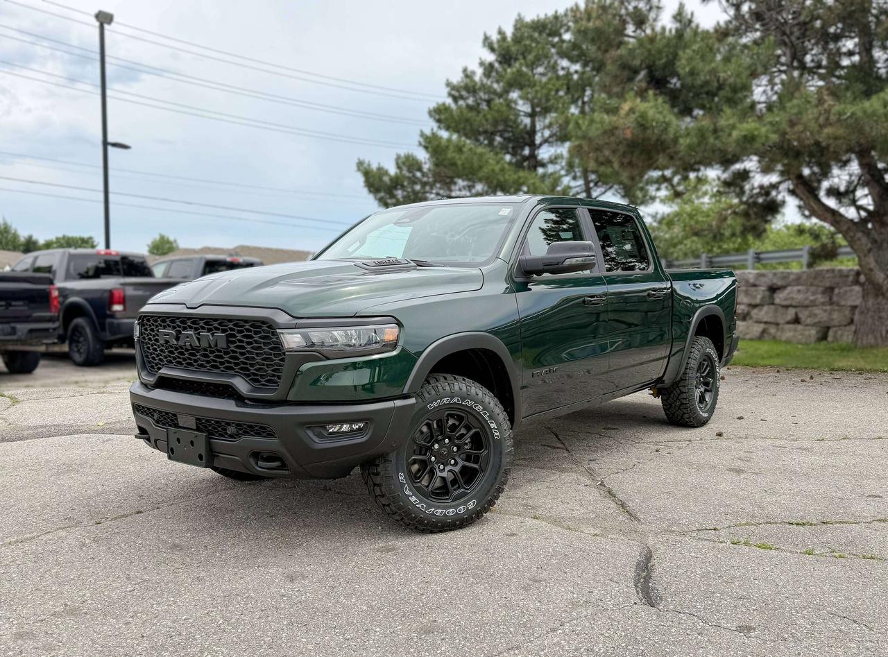 With rugged hardware and trail-tuned confidence, our New 2026 RAM 1500 Rebel Crew Cab 4X4, equipped with the Level 2 Equipment Package in Serrano Green Metallic dares you to push past your limits. Motivated by a Twin-TurboCharged 3.0 Litre Hurricane 6 Cylinder delivering 420hp to an 8 Speed Automatic transmission engineered for off-road domination. A raised ride height, performance shocks, and a shift-on-demand transfer case can take this Four Wheel Drive truck further down the trail, and it achieves approximately 9.8L/100km on the highway. Our fierce and stylish RAM features LED lighting, fog lamps, a sport performance hood, bold graphics, black alloy wheels, dual-panel sunroof, off-road fender flares, and robust skid plates.  Our Rebel cabin is ready for rough terrain, thanks to its Level 2 Equipment Pack, which features heated/ventilated luxury leather front seats, eight-way power adjustment for the driver, heated rear seats, a heated-wrapped steering wheel, dual-zone automatic climate control, 12V/115V outlets, a power rear window, and remote start. Off-Road Info Pages enhance the infotainment system with Uconnect&reg; 5 14.4-inch touchscreen display, full-color navigation, WiFi compatibility, Android Auto&reg;/Apple CarPlay&reg;, Bluetooth&reg;, voice control, dual wireless charging, and a nineteen-speaker Harman Kardon&reg; audio sound system.  For safetys sake, RAM supplies front/rear auto braking, blind-spot monitoring, adaptive cruise control, active lane management, trailer sway damping, hill-start assistance, and more. Committed to truck leadership, our 1500 Rebel is a compelling choice! Save this Page and Call for Availability. We Know You Will Enjoy Your Test Drive Towards Ownership!