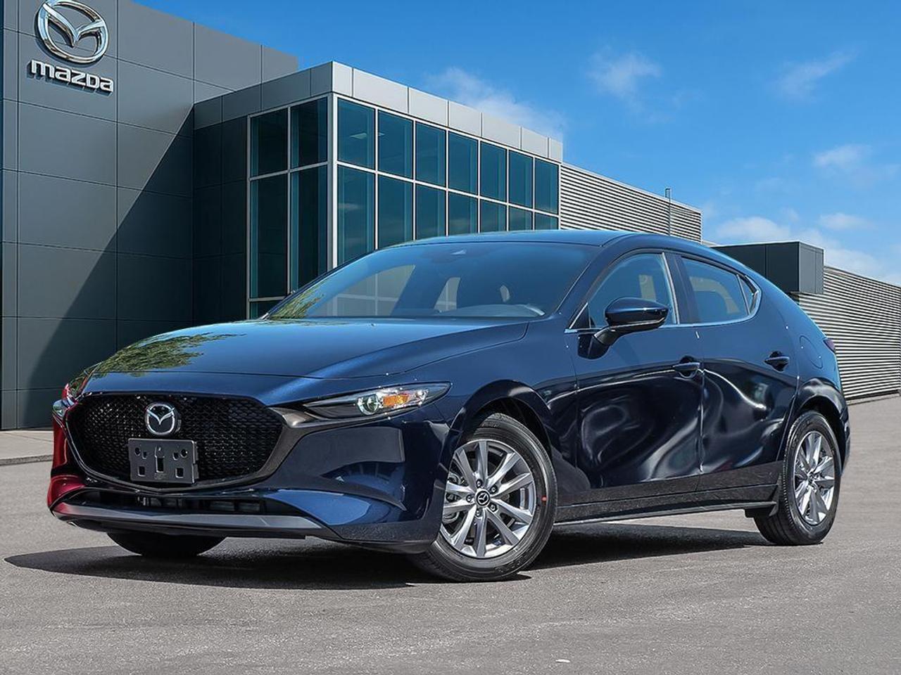 <p>Experience the all-new 2026 Deep Crystal Blue Mica Mazda3 Sport GS Auto FWD. This stunning front-wheel-drive sedan offers an exceptional balance of power and poise, ensuring a sublime driving experience on every journey.</p><p>The captivating blue exterior is complemented by stylish alloy wheels and heated mirrors, exuding confidence and elegance at every angle. Step inside to find a cozy black interior featuring heated front seats, a leather steering wheel, and intricately designed metal-look instrument panel trim.</p><p>This Mazda3 Sport is equipped with an array of technology and safety features designed to enhance your driving experience. It includes an intuitive smart device integration system, a crisp backup camera, Bluetooth connectivity, and adaptive cruise control. Additionally, driver assistance tools such as lane assist and brake assist provide extra peace of mind on the road.</p><p>Perfect for urban commuters and small families alike, the 2026 Mazda3 Sport GS caters to those who value style and performance. Contact Cobourg Mazda today to learn more about this remarkable vehicle and take the first step towards owning your dream car.</p>