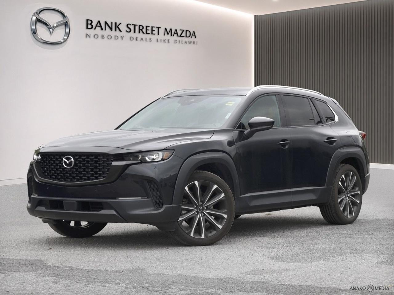 Experience the excitement of driving the 2024 Mazda CX-50 GT in a stunning black exterior with all-wheel drive (AWD) precision. This SUV offers unmatched handling that makes it perfect for any adventurous journey. The black Mazda CX-50 GT presents an exquisitely designed exterior, accentuated by sleek alloy wheels and a modern profile. Its interior is equally captivating, featuring luxurious leather seats and a leather steering wheel for a touch of elegance. Add a sunroof/moonroof for a panoramic view on the go, and experience the ultimate comfort with heated and cooled front seats, heated rear seats, and power-adjustable functionalities to tailor your driving experience. Stay connected and entertained with the advanced navigation system, smart device integration, satellite radio, and a premium sound system. Enjoy the convenience of a heads up display, backup camera, and parking sensors that enhance safety and ease every drive. With the inclusion of lane assist, adaptive cruise control, and keyless entry, this CX-50 ensures you travel with confidence and style. The 2024 Mazda CX-50 GT AWD is perfect for those who seek adventure without compromising luxury and technology. Whether youre navigating city streets or exploring off the beaten path, this vehicle has everything you need. Contact Bank Street Mazda today to learn more or to schedule a test drive and make this exceptional SUV yours!