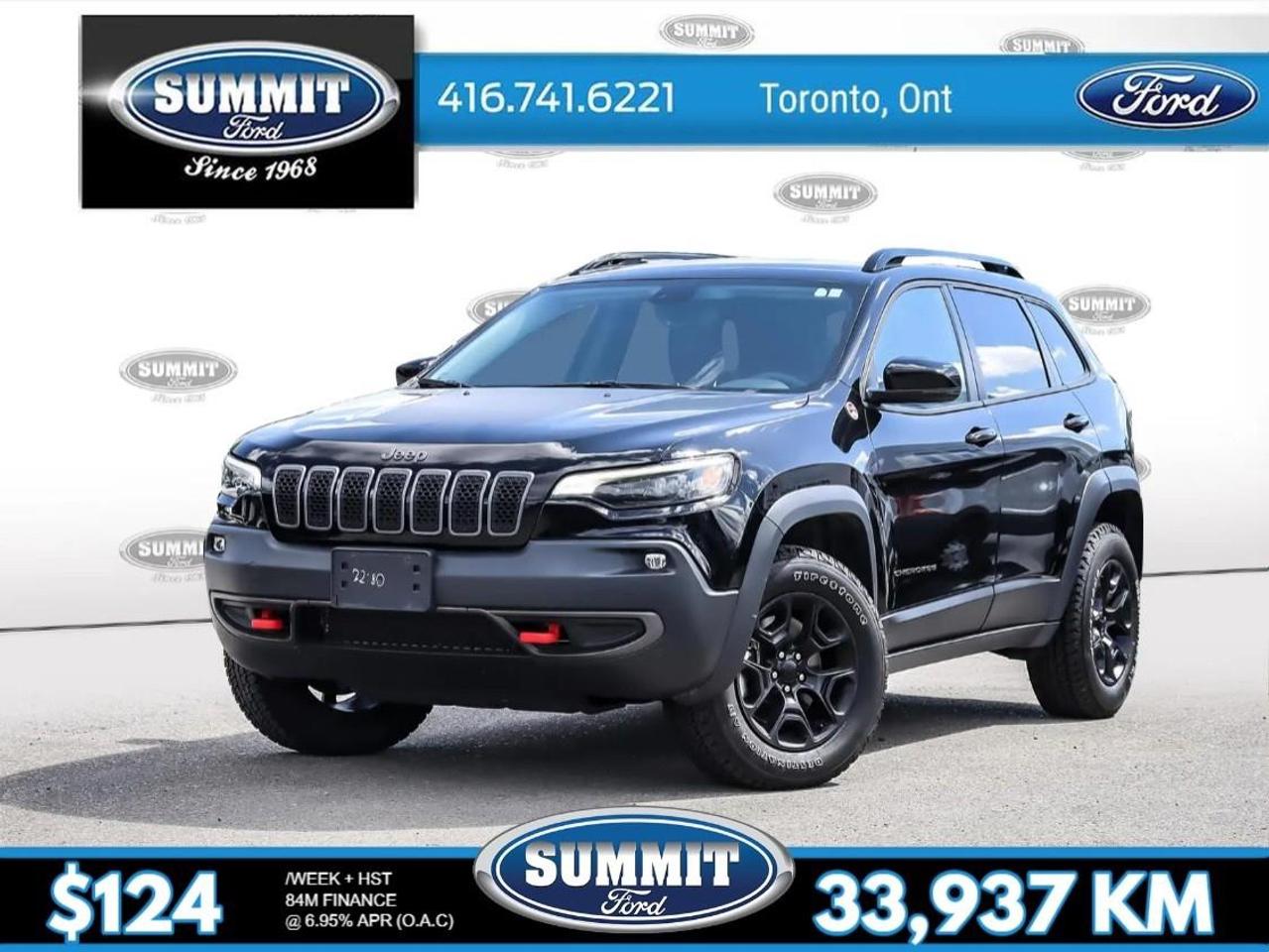 <p>The <strong>2022 Jeep Cherokee Trailhawk 4x4</strong> in a striking black finish is ready to conquer any terrain with its rugged 4x4 drivetrain and impressive handling capabilities. This SUV is your ticket to both adventure and everyday practicality.</p><p>The exterior exhibits a commanding presence with its sturdy build, adorned with alloy wheels that add a touch of sophistication. Inside, the black interior exudes style and comfort, featuring heated front seats and a leather-wrapped steering wheel that elevate the driving experience. The convenience of keyless entry and power seats ensures every journey is as comfortable as possible.</p><p>Tech-savvy drivers will appreciate the smart device integration, along with the intuitive interface of the infotainment system. The vehicle is equipped with modern safety features, including a backup camera, lane assist, and parking sensors, providing peace of mind on every drive. The addition of a brake assist system and heated mirrors further enhances safety and convenience.</p><p>Perfect for adventurous families and off-road enthusiasts, the Jeep Cherokee Trailhawk combines robust performance with modern amenities. Contact Summit Ford to learn more about this exceptional vehicle and take it for a test drive today!</p>