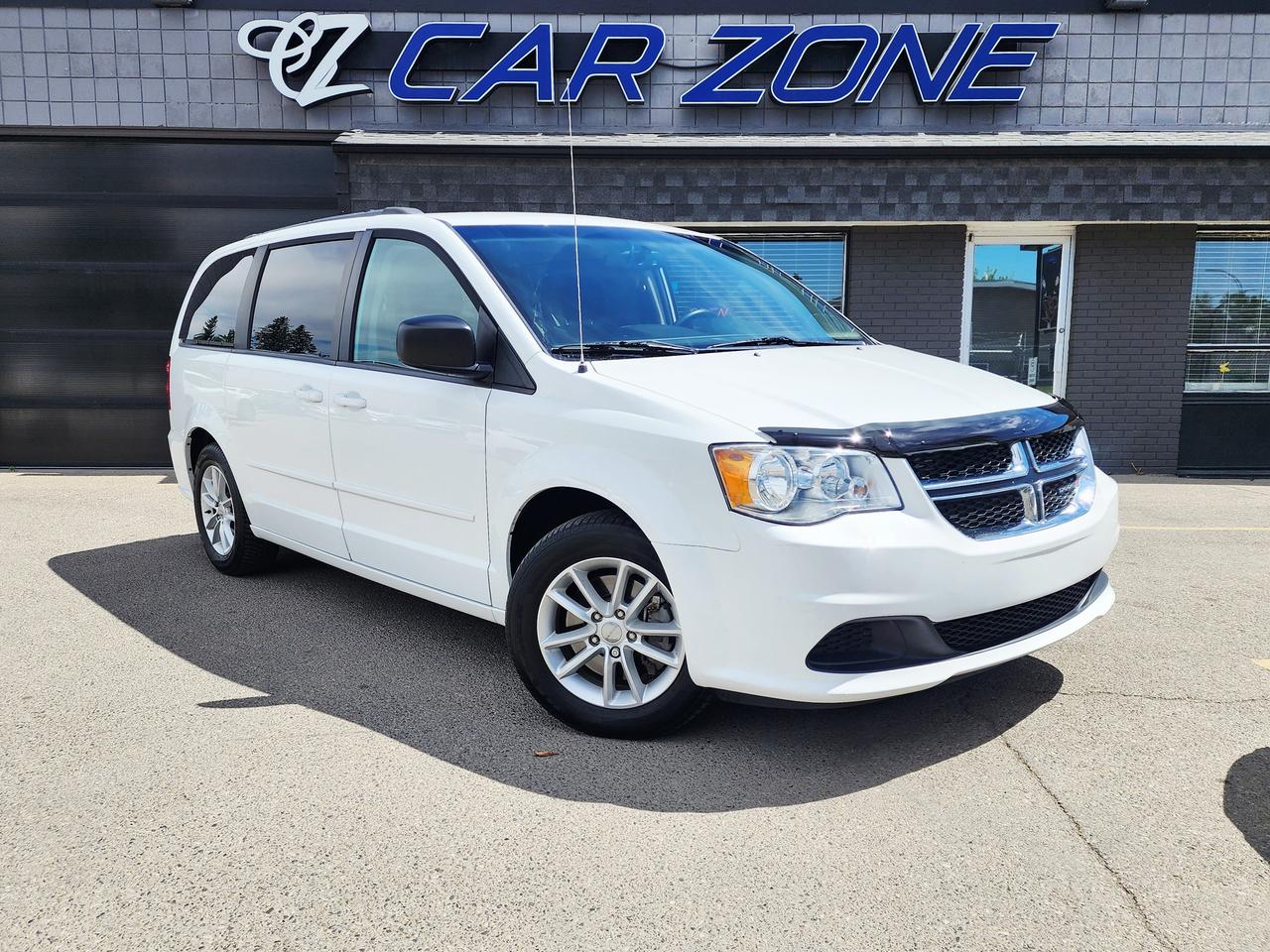 <p>Looking for a reliable and spacious ride for your family adventures? Car Zone has the perfect solution with this pre-owned 2016 Dodge Grand Caravan SXT. Finished in a clean white exterior and a sleek black interior, this minivan offers comfort and practicality for every journey. Under the hood, youll find a capable 3.6L V6 engine paired with a smooth automatic transmission, ensuring a confident drive whether youre navigating city streets or cruising on the highway. With 87,002 kilometers on the odometer, this Grand Caravan is ready for many more miles of memories.</p><p>This 2016 Dodge Grand Caravan SXT is designed with your needs in mind, offering ample space for passengers and cargo alike. The flexible fuel capability means you can choose the most economical option at the pump, and the front-wheel-drive provides dependable handling in various Canadian weather conditions. Its versatile minivan body style makes it ideal for everything from daily commutes to road trips, and the four doors offer easy access for everyone. Come on down to Car Zone and see how this Grand Caravan can become your familys trusted companion.</p><p>Here are 5 sizzling features of this 2016 Dodge Grand Caravan SXT:</p><ul><li><strong>Spacious Seating for the Whole Crew:</strong> With ample room for up to seven passengers, say goodbye to cramped car rides and hello to comfortable family outings.</li><li><strong>Powerful 3.6L V6 Engine:</strong> Experience smooth acceleration and confident power for highway merging and spirited driving.</li><li><strong>Versatile Flex Fuel Capability:</strong> Enjoy the flexibility and potential cost savings of choosing your fuel option at the pump.</li><li><strong>Smooth Automatic Transmission:</strong> Effortlessly navigate through gears for a relaxed and enjoyable driving experience.</li><li><strong>Practical Front-Wheel Drive:</strong> Benefit from dependable traction and handling, providing peace of mind on Canadian roads.</li></ul><p>Looking for Your Dream Car? Call Car Zone Today!</p><p>Thanks for viewing our Car Zone inventory. All of our vehicles come fully detailed with a Carfax and a mechanical fitness assessment. Drive this home today! Easy financing options. All credit welcome.&nbsp;<strong><a href=http://www.calgary.ca/finance>APPLY NOW</a>&nbsp;</strong>We even take trades. Same day approvals at&nbsp;<a href=http://www.carzonecalgary.ca/><strong>CARZONECALGARY</strong></a> or visit us in person at 2036 36 Street SE Calgary for a hassle free test drive. Let our friendly team of experts book an appointment with you and show you the Car Zone difference! AMVIC licensed dealer.&nbsp;</p>