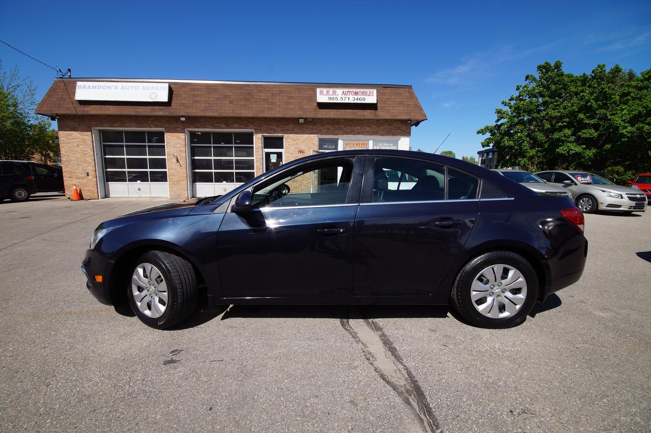 <p>Experience the perfect blend of style, comfort, and practicality with this pre-owned 2016 Chevrolet Cruze LT, available now at R.E.R. Automobiles Ltd. Dressed in a sleek black exterior and complemented by a sophisticated black interior, this four-door sedan presents a timeless and elegant look. Whether youre navigating city streets or embarking on a longer journey, the Cruze LT offers a smooth and reliable ride, thanks to its efficient gasoline engine and responsive automatic transmission, all channeled through a front-wheel-drive system for confident handling.</p><p>With 159,011 kilometers on the odometer, this Chevrolet Cruze LT has been well-traveled and is ready for its next adventure. Its a fantastic option for anyone seeking a dependable and well-equipped vehicle that doesnt compromise on everyday usability. The spacious interior provides ample room for both passengers and cargo, making it an ideal choice for daily commutes, family outings, or weekend getaways.</p><p>Here are five features of this 2016 Chevrolet Cruze LT that are sure to impress:</p><ul><li><strong>Sleek Black Exterior:</strong> Turn heads with the classic and commanding presence of its deep black finish, exuding a sense of modern sophistication.</li><li><strong>Comfortable Black Interior:</strong> Sink into the refined and stylish black interior, designed to offer both a premium feel and lasting durability.</li><li><strong>Smooth Automatic Transmission:</strong> Enjoy effortless gear changes and a seamless driving experience, making every journey more relaxed and enjoyable.</li><li><strong>Responsive Gasoline Engine:</strong> Benefit from the efficient yet capable performance of the gasoline engine, offering a balanced blend of power and fuel economy for your daily drives.</li><li><strong>Four-Door Sedan Practicality:</strong> Appreciate the convenient access and versatile space offered by the four-door sedan body style, perfect for passengers and all your gear.</li></ul><p><strong><em>Powered by AutoIntelligence&trade;</em></strong></p><p>Vehicle information has been generated using artificial intelligence and is provided for informational purposes only. While efforts are made to ensure accuracy, please confirm all details directly with the dealer.</p>