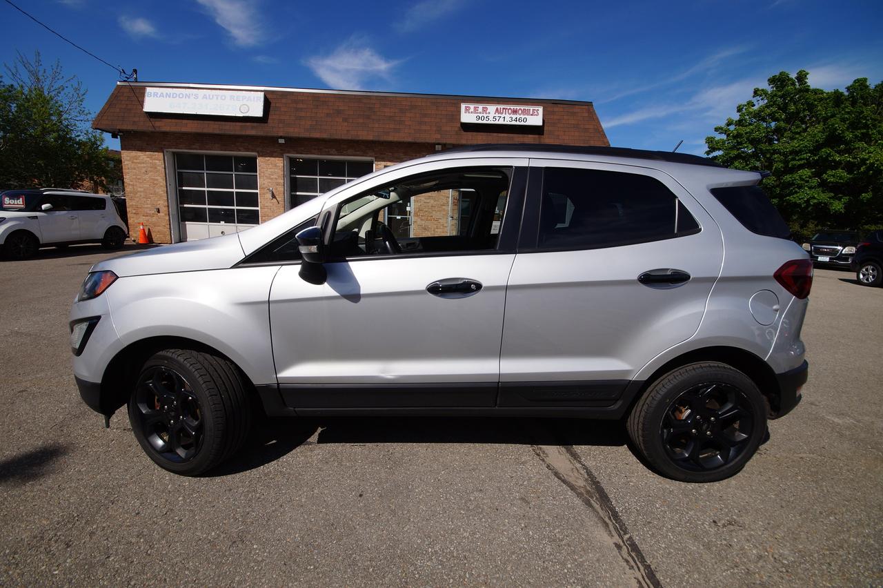 <p>Experience the perfect blend of versatility and urban agility with this pre-owned 2021 Ford EcoSport SES, available now at R.E.R. Automobiles Ltd. Finished in a sophisticated gray exterior and complemented by a sleek black interior, this compact SUV is designed to handle your daily commute and weekend adventures with equal ease. The EcoSport SES offers a comfortable and stylish ride, making it an ideal choice for those seeking a capable and modern vehicle.</p><p>This 2021 Ford EcoSport SES boasts a robust 4-wheel drive system, ready to tackle various road conditions and weather you might encounter across Canada. With just 142,461 kilometers on the odometer, this EcoSport has plenty of life left to offer its next owner. Its compact size makes it easy to navigate city streets and park in tight spots, while its elevated ride height provides a commanding view of the road.</p><p>Discover the joy of driving a vehicle that&rsquo;s both practical and fun. This EcoSport SES is equipped to enhance your driving experience, offering a refined interior and a capable powertrain. Visit R.E.R. Automobiles Ltd. to see how this 2021 Ford EcoSport SES can fit seamlessly into your lifestyle.</p><p>Here are 5 sizzling features of this 2021 Ford EcoSport SES:</p><ul><li><strong>4-Wheel Drive Capability:</strong> Conquer any Canadian road condition with confidence, from city streets to snowy backroads.</li><li><strong>Sporty SES Trim:</strong> Elevate your drive with the distinctive styling and enhanced features that come with the sought-after SES trim level.</li><li><strong>Compact SUV Versatility:</strong> Enjoy the perfect balance of a nimble driving experience and ample cargo space for all your gear.</li><li><strong>Smooth Automatic Transmission:</strong> Effortlessly navigate traffic and enjoy a relaxed driving experience with the responsive automatic gearbox.</li><li><strong>Commanding SUV Ride Height:</strong> Gain a superior view of your surroundings, adding to both safety and driving enjoyment.</li></ul><p><strong><em>Powered by AutoIntelligence&trade;</em></strong></p><p>Vehicle information has been generated using artificial intelligence and is provided for informational purposes only. While efforts are made to ensure accuracy, please confirm all details directly with the dealer.</p>