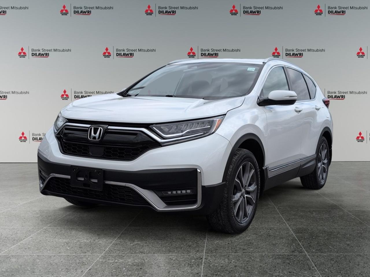 Balance of 5 year/100,000kms BASIC warranty and 10 year/160,000kms Factory Powertrain Warranty on ALL MITSUBISHI products! Best in the industry!!!! Introducing the stunning 2022 Honda CR-V Touring AWD in a pristine white finish, designed to handle any road with confidence thanks to its advanced AWD drivetrain and smooth automatic transmission. This SUV promises to deliver both style and performance on your daily adventures. On the outside, the CR-V captivates with its elegant silhouette, while inside, a world of comfort and luxury awaits. The leather seats envelop you in sophistication, complemented by power-adjustable seating to ensure perfect comfort. A sunroof/moonroof enhances the spacious feel of the cabin, letting in natural light and offering the joy of an open-air experience. At the forefront of technology, this CR-V features a cutting-edge navigation system and a high-resolution touchscreen for seamless access to satellite radio, Bluetooth connectivity, and smart device integration. Safety is paramount with driver assistance features such as lane assist, a backup camera, brake assist, and cruise control, ensuring you and your passengers peace of mind. Whether youre a family seeking space and reliability or an adventure-seeker in need of versatility, this 2022 Honda CR-V Touring AWD is engineered to meet your lifestyle. Contact Bank Street Mitsubishi today to schedule your test drive and experience everything this exceptional vehicle has to offer.
