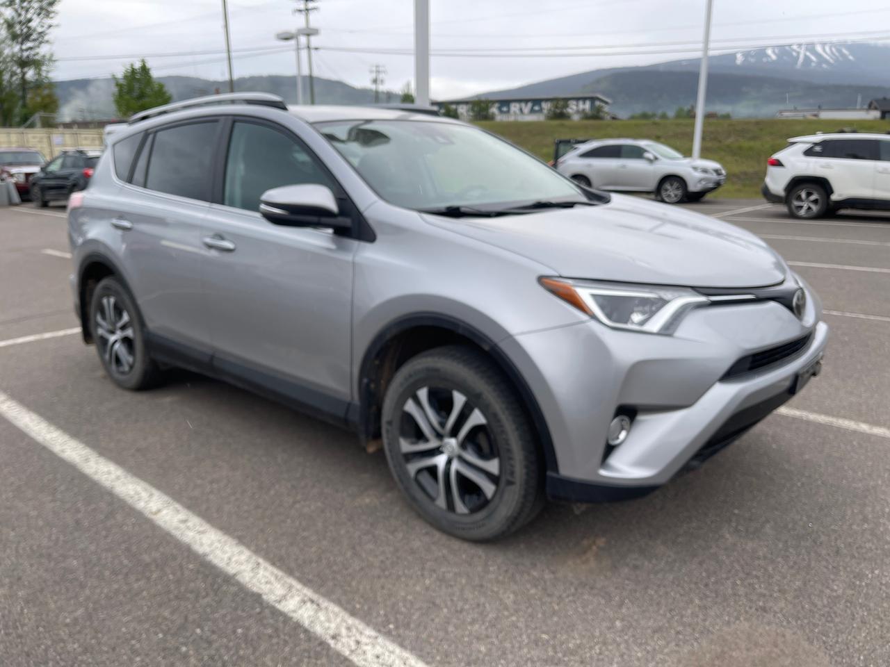 <p>Looking for a reliable and versatile SUV thats ready for anything Canadian roads can throw at it? Smithers Toyota has the perfect vehicle for you: a pre-owned 2017 Toyota RAV4 LE. This all-wheel-drive powerhouse is built to handle diverse weather conditions and terrains, making it an ideal companion for your daily commute, weekend adventures, and everything in between. With 115,404 kilometers on the odometer, this RAV4 has been well-maintained and is eager to continue serving its next owner with Toyotas renowned dependability.</p><p>&nbsp;</p><p>Step inside this 2017 RAV4 LE and discover a comfortable and practical interior designed for your convenience. The spacious cabin offers ample room for passengers and cargo, while the thoughtful features ensure a pleasant driving experience. Whether youre navigating city streets or exploring the great outdoors, this RAV4 LE provides the capability and comfort you need.</p><p>&nbsp;</p><p>Here are five features that make this 2017 Toyota RAV4 LE truly stand out:</p><p><br><br></p><ul><li><strong>All-Wheel Drive:</strong> Conquer any road condition with confidence. This RAV4s advanced all-wheel-drive system provides superior traction and stability, ensuring a secure and smooth ride whether youre facing snow, rain, or gravel.</li></ul><p>&nbsp;</p><ul><li><strong>Adaptive Cruise Control:</strong> Enjoy a more relaxed and safer driving experience on the highway. This intelligent system automatically adjusts your speed to maintain a set distance from the vehicle ahead, reducing driver fatigue.</li></ul><p>&nbsp;</p><ul><li><strong>Heated Front Bucket Seats:</strong> Stay warm and comfortable during those chilly Canadian mornings. These plush heated seats offer an extra layer of comfort for both the driver and front passenger.</li></ul><p>&nbsp;</p><ul><li><strong>Back-Up Camera:</strong> Parking and maneuvering in tight spaces are made effortless. The integrated back-up camera provides a clear view of whats behind your vehicle, helping you avoid obstacles.</li></ul><p>&nbsp;</p><ul><li><strong>Collision Mitigation-Front:</strong> Drive with enhanced peace of mind. This advanced safety feature actively works to help prevent or reduce the severity of frontal collisions, adding an extra layer of protection for you and your passengers.</li></ul><p><br><br></p><p><strong><em>Powered by AutoIntelligence&trade;</em></strong></p><p>&nbsp;</p><p>Vehicle information has been generated using artificial intelligence and is provided for informational purposes only. While efforts are made to ensure accuracy, please confirm all details directly with the dealer.</p><p>&nbsp;</p>