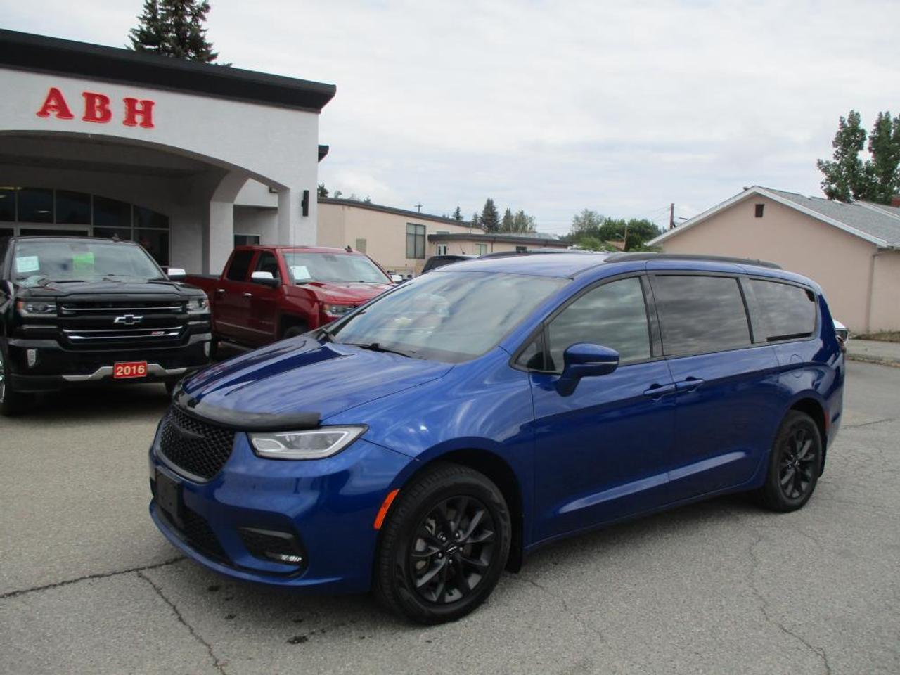 Check out this stylish and family-friendly 2021 Chrysler Pacifica Touring-L S AWD! Powered by a dependable 3.6L V6 paired to a smooth shifting 9-speed automatic transmission, this Pacifica delivers excellent performance, comfort, and confidence year-round with its intelligent all-wheel drive system.

This fully loaded Touring-L S package comes equipped with full Stow n Go seating, making it incredibly versatile for passengers or cargo. Inside youll find dual zone climate control with rear air and heat, Bluetooth connectivity, steering wheel audio controls, heated front seats, heated steering wheel, power drivers seat, navigation, rear backup camera, overhead DVD entertainment system, power sliding side doors, and power liftgate. Safety features include lane departure warning and lane change alert for added peace of mind.

With seating for up to 7 passengers, this Pacifica is the perfect family vehicle for road trips, daily commuting, or hauling the whole crew in comfort and style. This is a 1-owner, original BC vehicle with a claims-free Carfax report and has clearly been very well cared for.

A loaded AWD Pacifica with all the right options  ready for its next family adventure! Dlr#9243