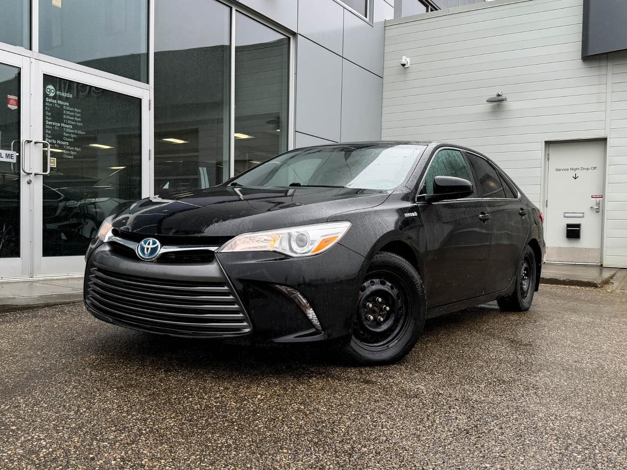 Experience exceptional fuel efficiency and reliable performance with this pre-owned 2017 Toyota Camry Hybrid LE 4-door sedan. Powered by a smooth 2.5L I-4 engine paired with a continuously variable transmission (CVT), this hybrid offers a perfect balance of power and eco-friendly driving. Enjoy comfort and convenience with features like dual-zone automatic climate control, power-adjustable drivers seat, and a spacious interior with cloth upholstery.Stay connected and entertained with the AM/FM CD player, 6.1-inch touchscreen, and steering wheel-mounted audio controls. Safety is paramount with 10 airbags, electronic stability control, and a rearview camera for confident driving. The Camry Hybrid LE is equipped with automatic headlights, keyless entry with push-button start, and regenerative braking for enhanced efficiency.With its smooth ride, advanced hybrid technology, and Toyotas renowned reliability, this Camry Hybrid LE is an ideal choice for a smart, comfortable, and economical daily driver. Contact us today to schedule your test drive!Vehicle previously registered in OntarioGo Mazda is a AMVIC licenced business
