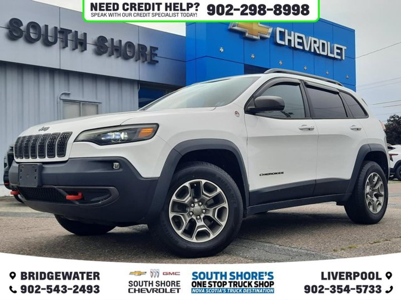 Recent Arrival! Bright White Clearcoat 2020 Jeep Cherokee Trailhawk For Sale, Bridgewater 4WD 9-Speed 948TE Automatic 2.0L I4 DOHC Clean Car Fax, 4-Wheel Disc Brakes, 4G LTE Wi-Fi Hot Spot, 6 Speakers, ABS brakes, Air Conditioning, Alloy wheels, Auto-Dimming Rear-View Mirror, Brake assist, Compass, Delay-off headlights, Driver door bin, Dual front impact airbags, Dual front side impact airbags, Electronic Stability Control, Engine Oil Cooler, Front Bucket Seats, Front fog lights, Fully automatic headlights, Google Android Auto, GPS Antenna Input, GPS Navigation, Hands-Free Power Liftgate, Heated door mirrors, Heated Steering Wheel, Illuminated entry, Knee airbag, Low tire pressure warning, Occupant sensing airbag, Outside temperature display, Overhead console, Panic alarm, ParkView Rear Back-Up Camera, Power door mirrors, Power windows, Quick Order Package 2ZL Trailhawk Elite, Radio data system, Radio: Uconnect 4C Nav w/8.4 Display, Rear window defroster, Remote keyless entry, Remote Start System, Roof rack: rails only, Security Alarm, SiriusXM Satellite Radio, SiriusXM Travel Link, Speed control, Speed-sensing steering, Tachometer, Telescoping steering wheel, Tonneau Cover, Traction control, Variably intermittent wipers, Windshield Wiper De-Icer.