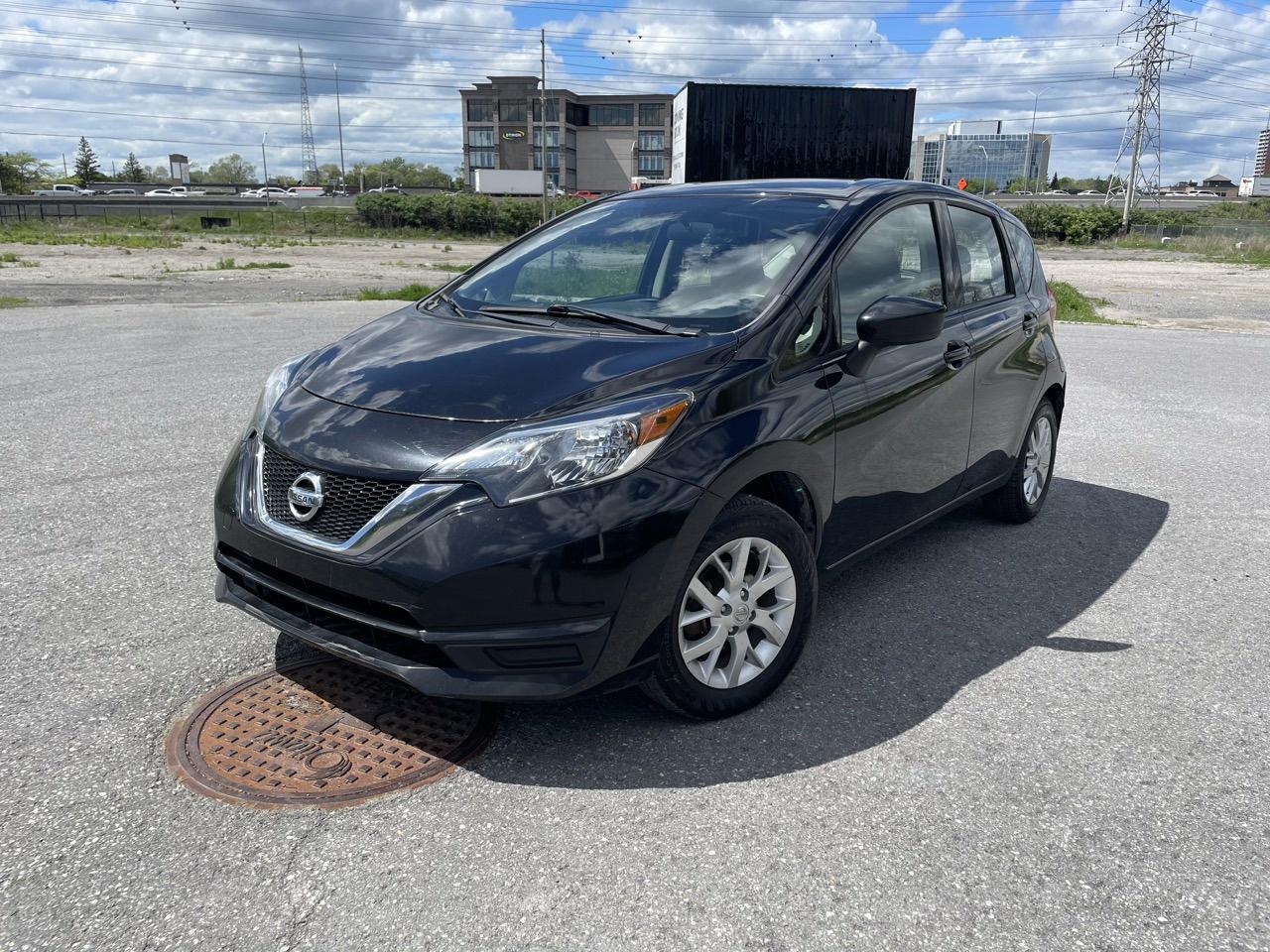 <p> 1.6L 4-Cylinder Engine<br data-start=52 data-end=55> Xtronic CVT Automatic Transmission<br data-start=91 data-end=94> Front-Wheel Drive (FWD)<br data-start=119 data-end=122> SV Trim Package<br data-start=139 data-end=142> 15 Alloy Wheels<br data-start=160 data-end=163> Rear Roof Spoiler<br data-start=182 data-end=185> Halogen Headlights<br data-start=205 data-end=208> Heated Power Side Mirrors<br data-start=235 data-end=238> Keyless Entry with Push Button Start<br data-start=276 data-end=279> Remote Start (if equipped)<br data-start=307 data-end=310> Air Conditioning<br data-start=328 data-end=331> Premium Cloth Seating Surfaces<br data-start=363 data-end=366> 60/40 Split Folding Rear Seats<br data-start=398 data-end=401> Height Adjustable Driver Seat<br data-start=432 data-end=435> Leather-Wrapped Steering Wheel<br data-start=467 data-end=470> Cruise Control<br data-start=486 data-end=489> Power Windows, Locks & Mirrors<br data-start=521 data-end=524> Tilt Steering Wheel<br data-start=545 data-end=548> 5 Colour Display Audio System<br data-start=580 data-end=583> Bluetooth Hands-Free Calling & Audio Streaming<br data-start=631 data-end=634> USB & Auxiliary Input<br data-start=657 data-end=660> AM/FM/CD Audio System<br data-start=683 data-end=686> Steering Wheel Mounted Audio Controls<br data-start=725 data-end=728> Rear View Camera<br data-start=746 data-end=749> Nissan Advanced Airbag System<br data-start=780 data-end=783> Vehicle Dynamic Control (VDC)<br data-start=814 data-end=817> Traction Control System<br data-start=842 data-end=845> Anti-Lock Braking System (ABS)<br data-start=877 data-end=880> Tire Pressure Monitoring System<br data-start=913 data-end=916> Rear Window Defroster & Wiper</p><p>This <strong data-start=994 data-end=1023>2018 Nissan Versa Note SV</strong> in black offers excellent fuel efficiency, versatile hatchback practicality, and affordable everyday driving. Powered by a reliable 1.6L engine paired with Nissans smooth Xtronic CVT transmission, it delivers a comfortable and economical ride perfect for commuting or city driving. Equipped with convenient features like keyless entry, backup camera, Bluetooth connectivity, and split folding rear seats, this Versa Note SV provides outstanding value, cargo flexibility, and dependable performance.</p>