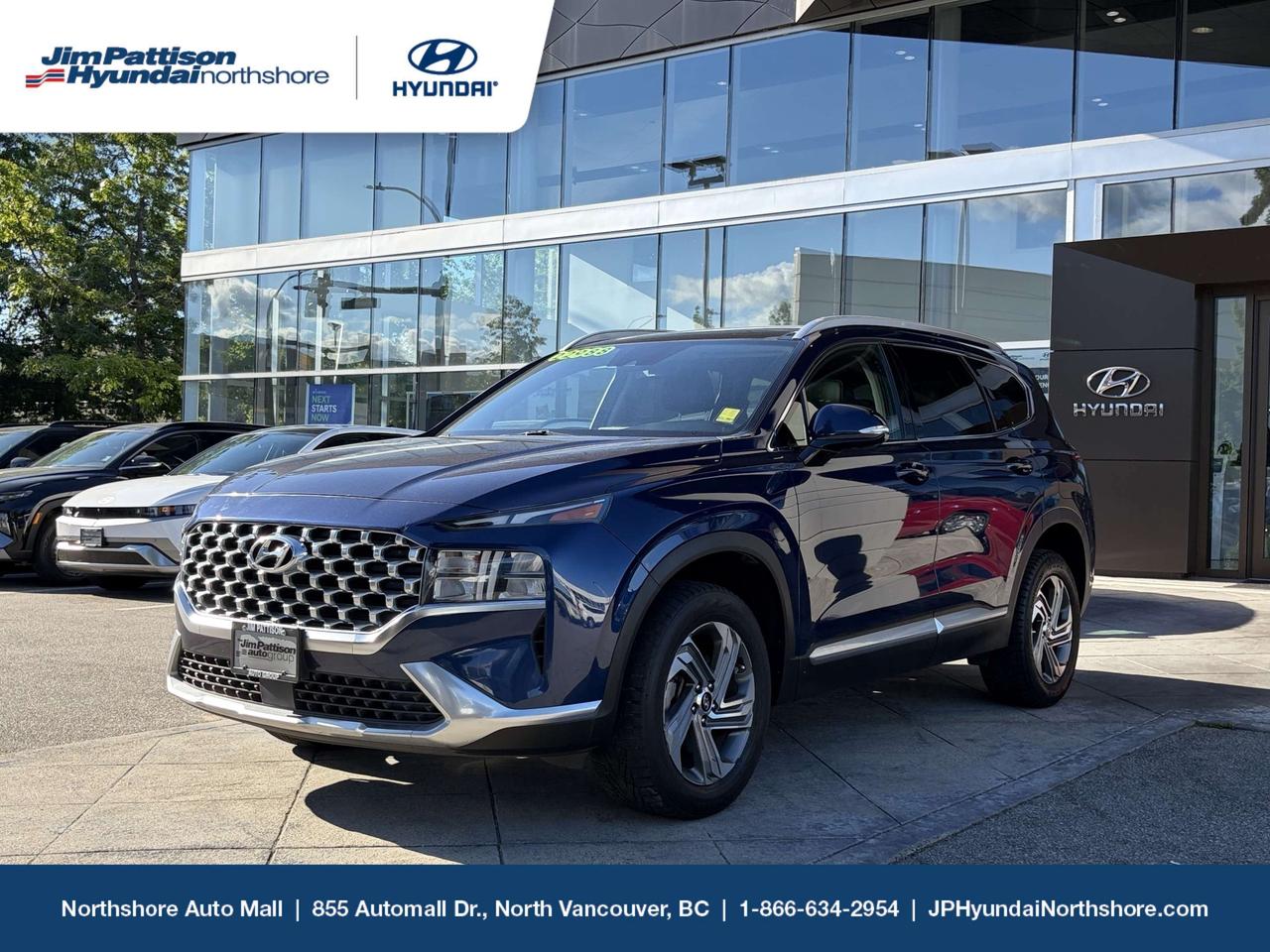 2021 Hyundai Santa Fe Trend AWD  Local, One Owner, Massively Discounted! Are you looking for maximum vehicle value without breaking the bank? This eye-catching 2021 Hyundai Santa Fe Trend AWD delivers premium safety, space, and modern styling for a fraction of the cost of a new model! It features an exceptional local history profile as a homegrown BC vehicle with only one previous owner.While it has traveled 136,500 kilometres, these are highly efficient highway kilometres accumulated across the province. Because it has bypassed heavy city gridlock, this Santa Fe looks, feels, and drives like a vehicle with half the mileage! THE "TREND" PACKAGE: PREMIUM COMFORT & STYLEForget basic entry-level trims. The upscale Trend Trim builds a truly elevated cabin experience with premium creature comforts engineered for our beautiful West Coast climate: Panoramic Sunroof: A massive glass panel that completely floods the spacious interior with beautiful natural light.Winter Protection: Heated front seats and a leather-wrapped heated steering wheel keep you perfectly warm on crisp mornings.Sophisticated Style: Finished in striking Stormy Sea Blue paint with matching dark accents, rolling on athletic alloy wheels.Push-Button Convenience: Proximity keyless entry with push-button ignition and an electronic push-button gear selector on a modern floating center console. CONFIDENCE & PERFORMANCE BUILT FOR THE NORTH SHOREUnder the hood sits a reliable, fuel-efficient 2.5L 4-cylinder engine mated to a smooth-shifting 8-speed automatic transmission.Safety & Performance Highlights:HTRAC All-Wheel Drive: Legendary traction to handle rain, slush, and heavy snow on your winter commutes up to Whistler or local ski mountains.Hyundai SmartSense Safety: High-end driver assistance features including Blind-Spot Collision-Avoidance Assist, Lane Keeping Assist, and Forward Collision-Avoidance to protect your family on every road trip.Spacious Cabin: Outstanding cargo capacity and an easy-folding second row to easily load up skis, mountain bikes, or camping gear.  FULLY INSPECTED AT JIM PATTISON HYUNDAI NORTHSHOREAs your trusted North Vancouver automotive destination, we ensure every vehicle meets high standards. Our factory-trained Hyundai technicians have put this Santa Fe through a comprehensive, multi-point mechanical safety and reconditioning process. We provide the complete CARFAX Canada Vehicle History Report upfront so you know its exact story. UNMATCHED SUV VALUE UNDER $21K  ACT FAST! Call Sales: (866) 634-2954Visit Our Showroom: 855 Automall Drive, North Vancouver, BCBook Your Drive: Schedule your test drive instantly online. Price includes dealer administration fee ($595) and VSA transaction levy ($10). Finance placement fee ($595) if applicable, GST and PST are additional. D#6700